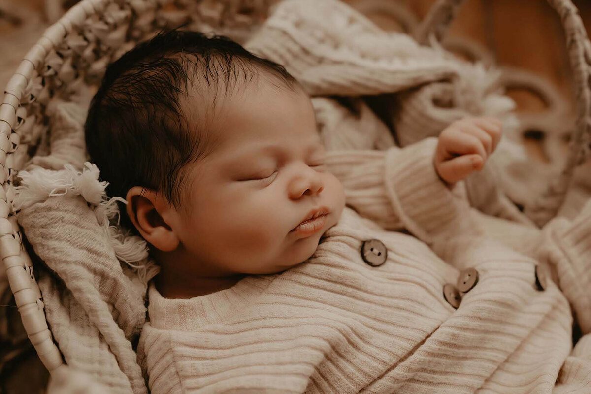 A sleeping baby in a basket in Canandaigua NY
