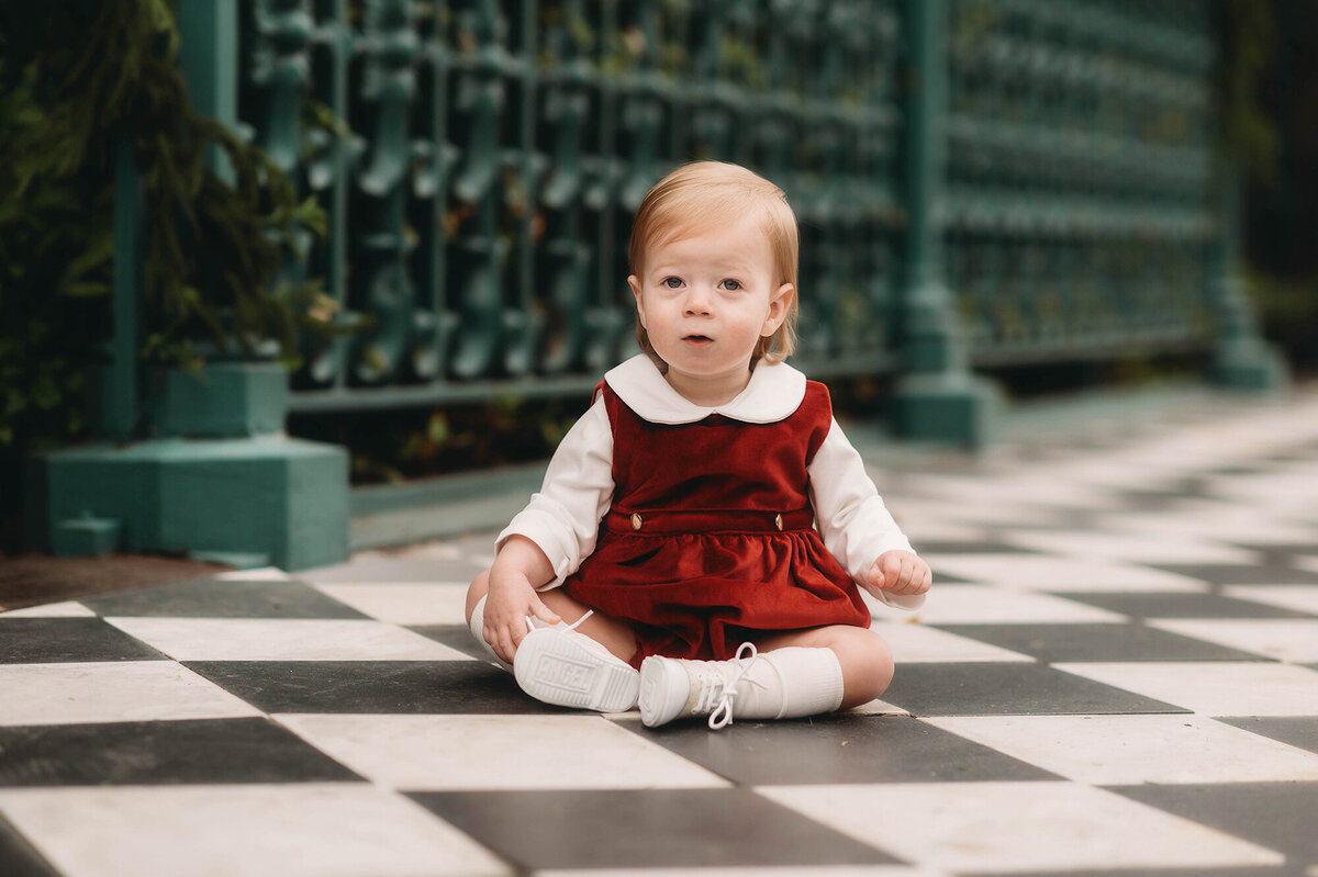 Baby peers into the camera during Family photoshoot in Charleston.