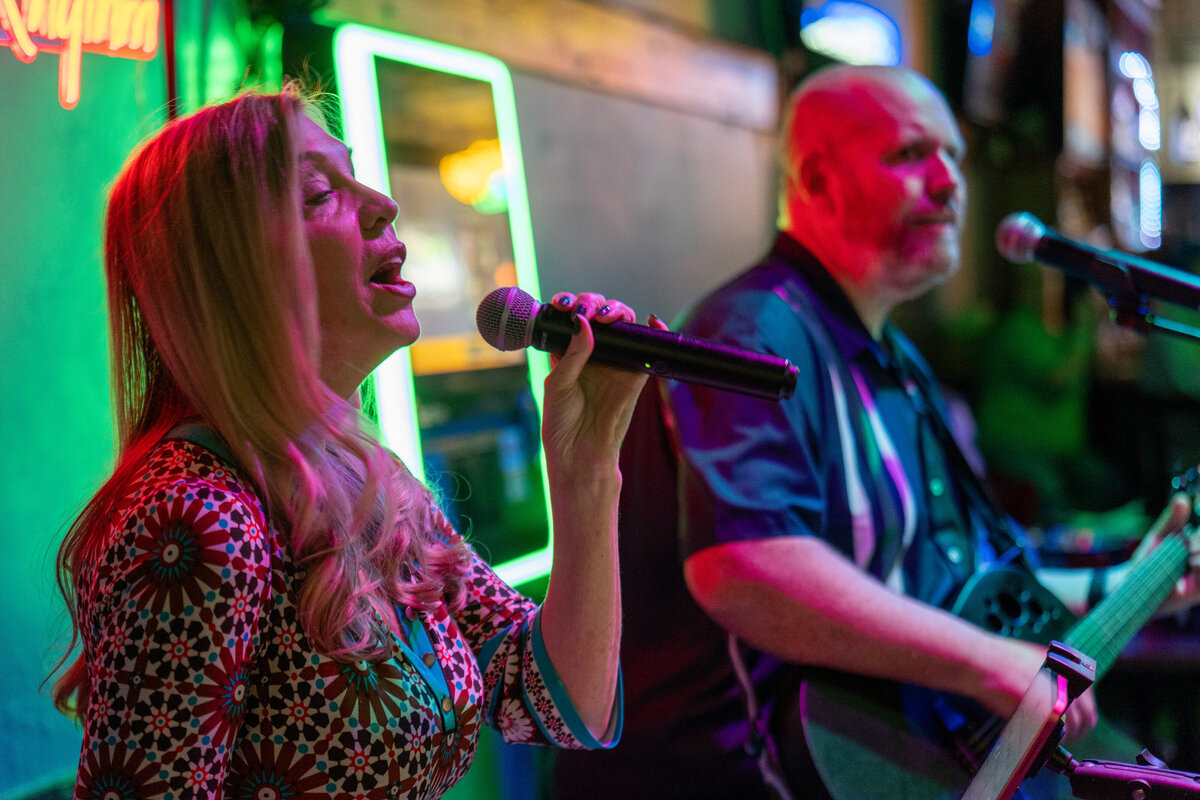 Two people playing music together 