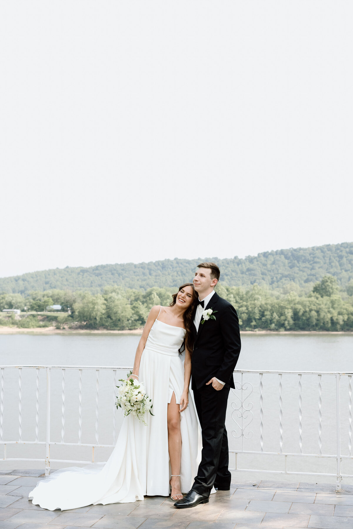 Bride and Groom by the lake during their destination wedding by Wymer Photography