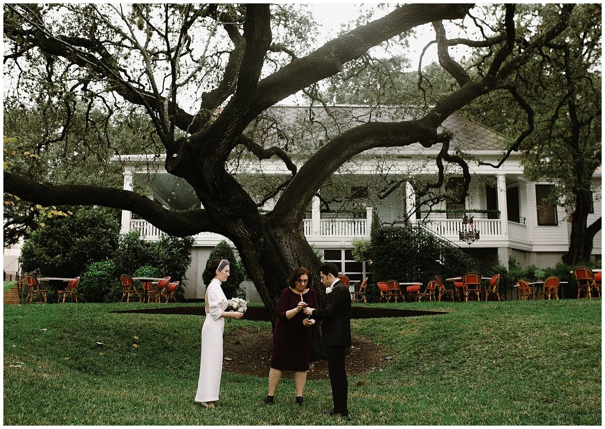 Bride and groom exchanging vows at elopement wedding at Hotel Cecilia Austin