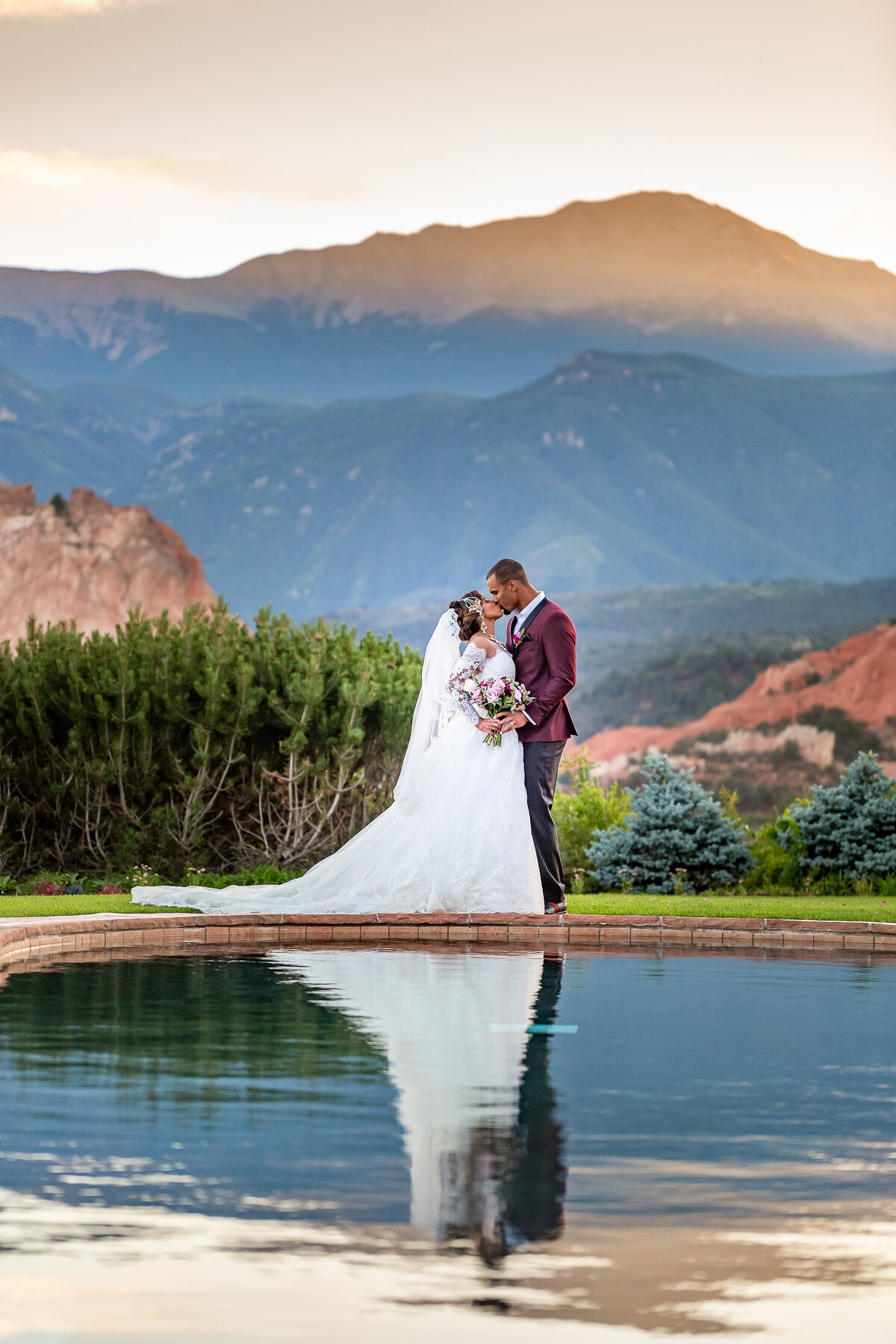 Bride and Groom Kiss at the Garden of the Gods Club