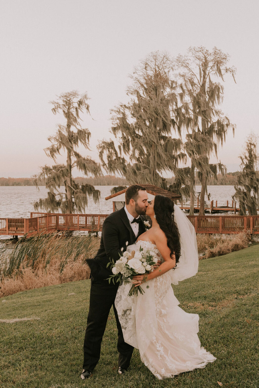 16 - Mision Lago Estate Wedding Bride & Groom Kissing - Tampa Bay Wedding Planner