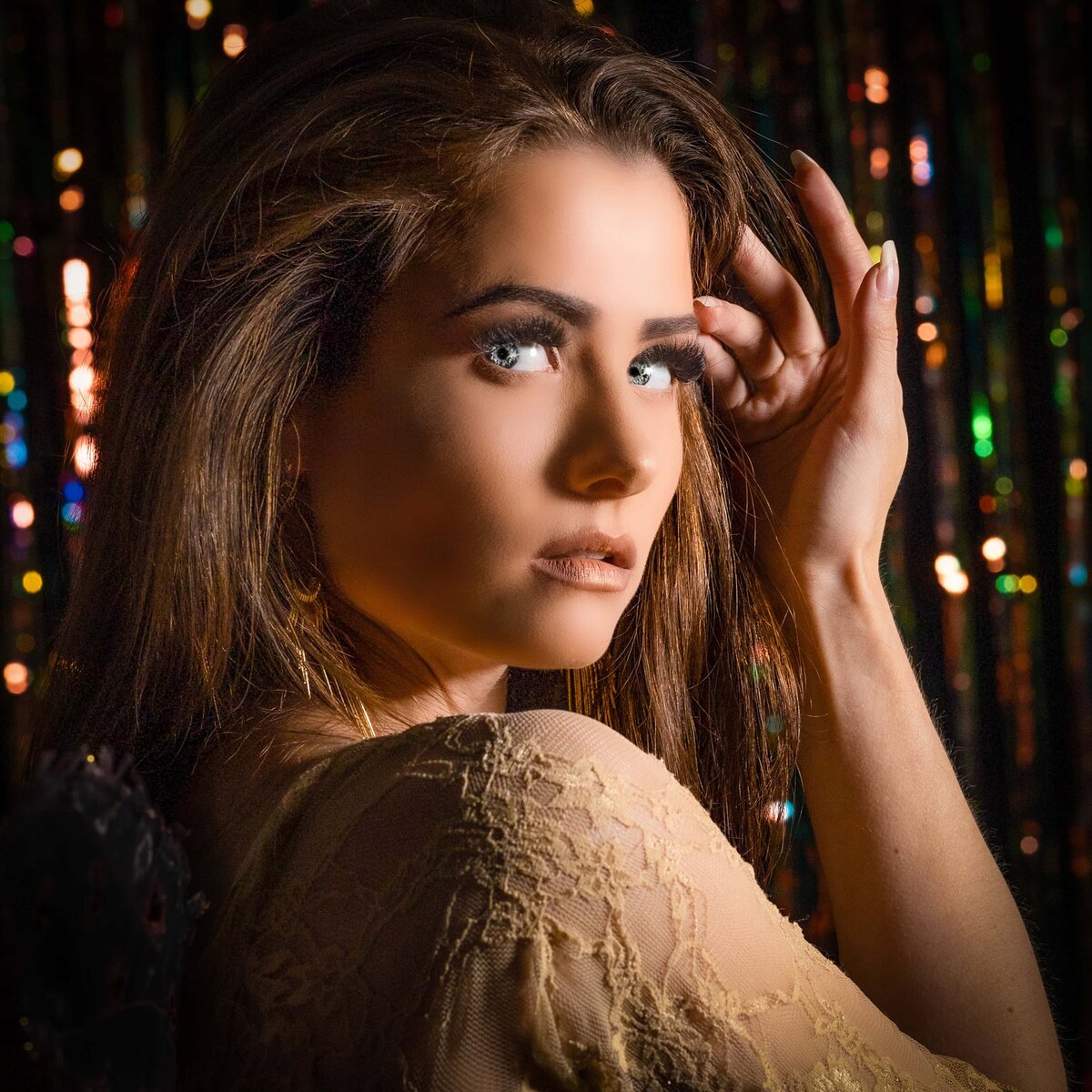 Glamourous woman against colorful background