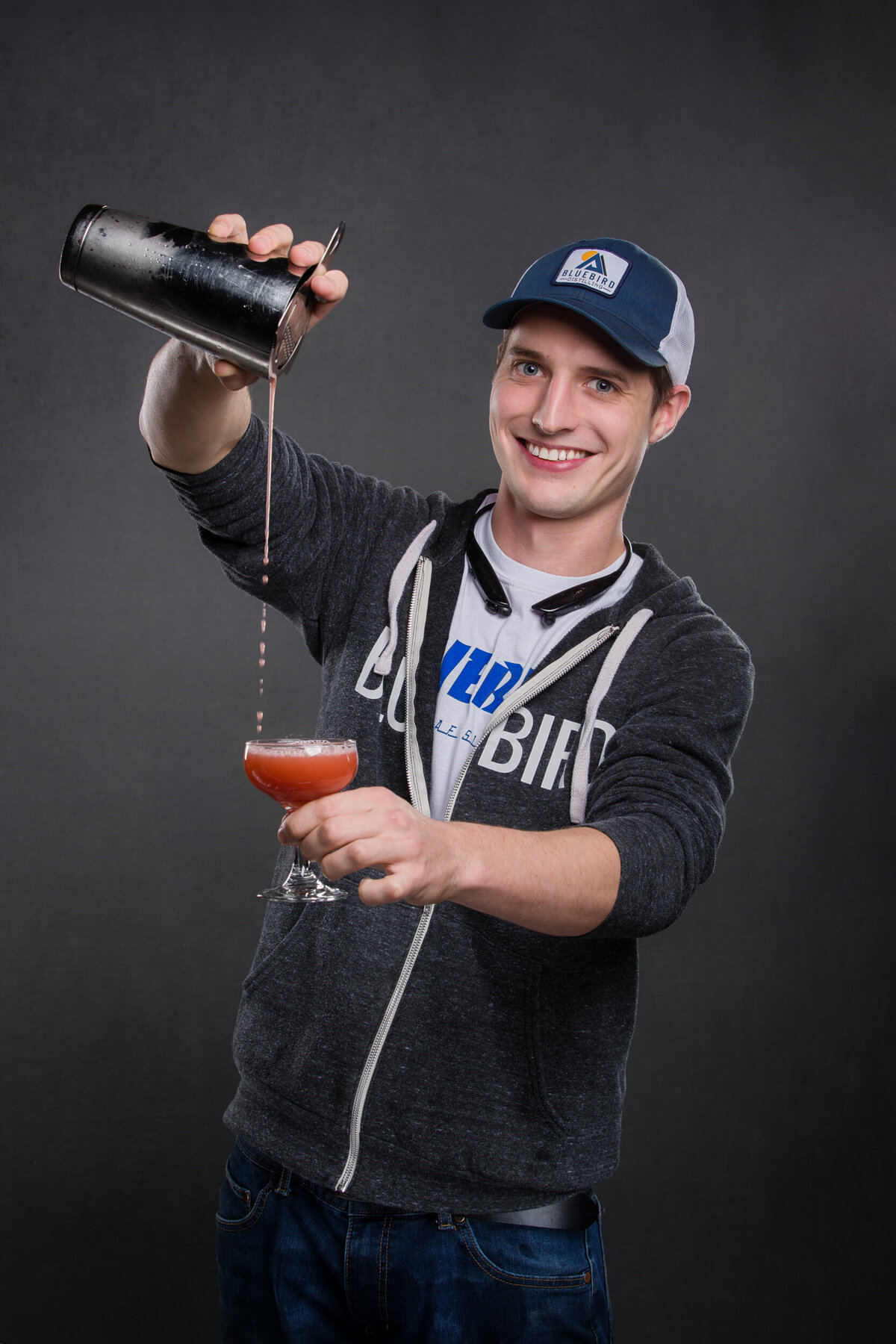 Branding photo of a bar tender pouring drinks