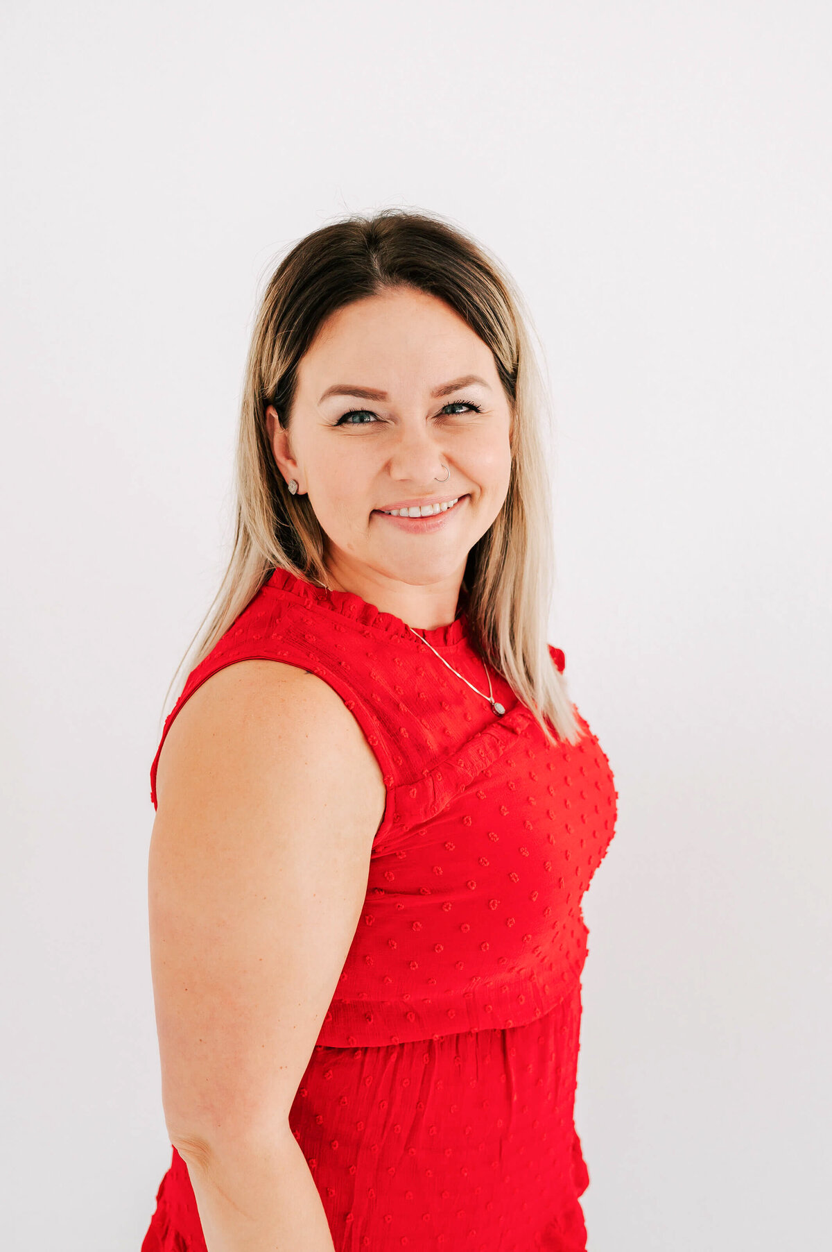 realtor headshot photo in Branson MO of woman in red dress