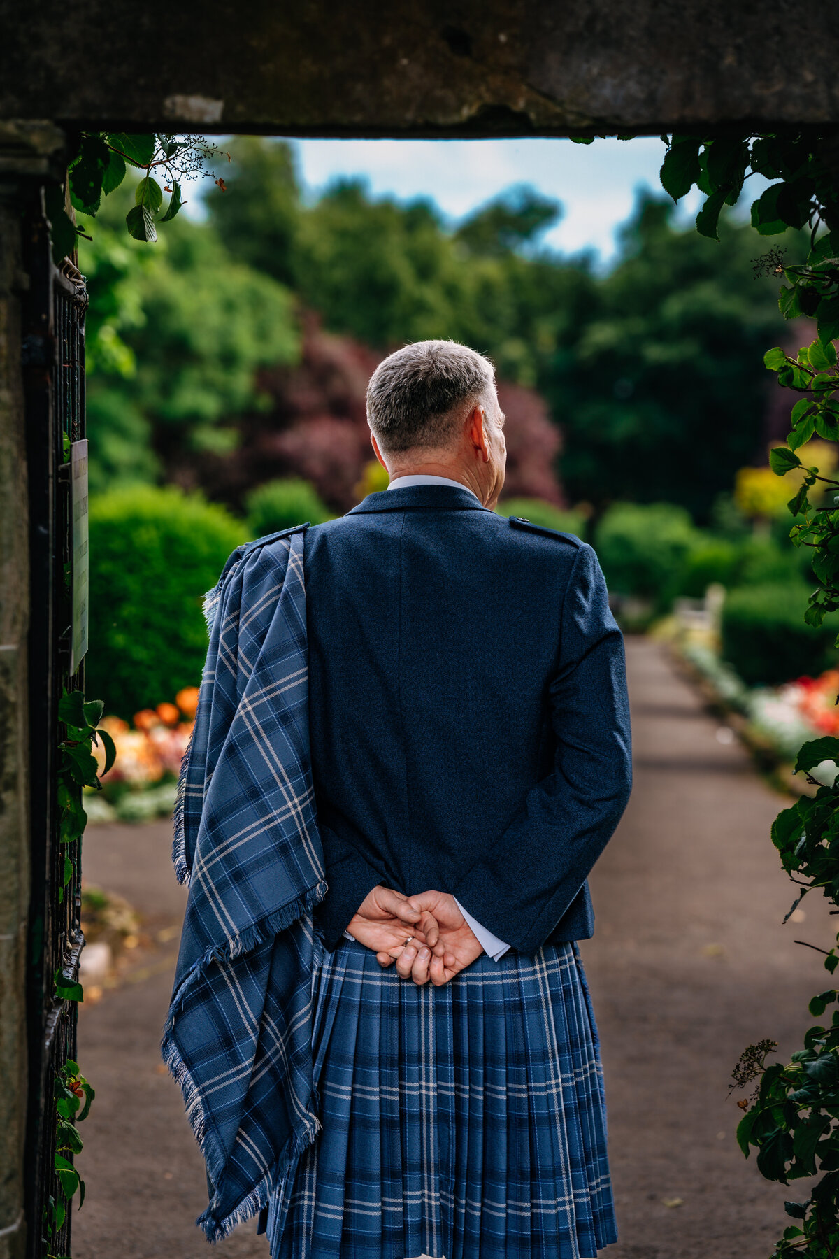 Groom waiting for bride and Glasgow botanical gardens