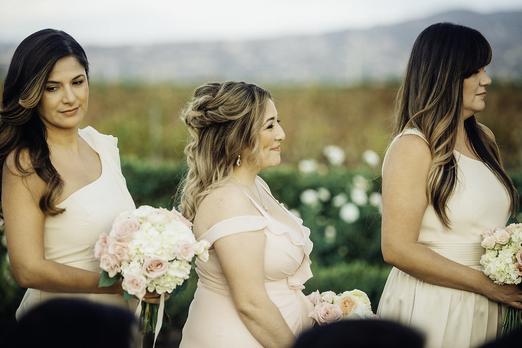 Wedding Photograph Of Three Bridesmaid in Peach Dresses Los Angeles