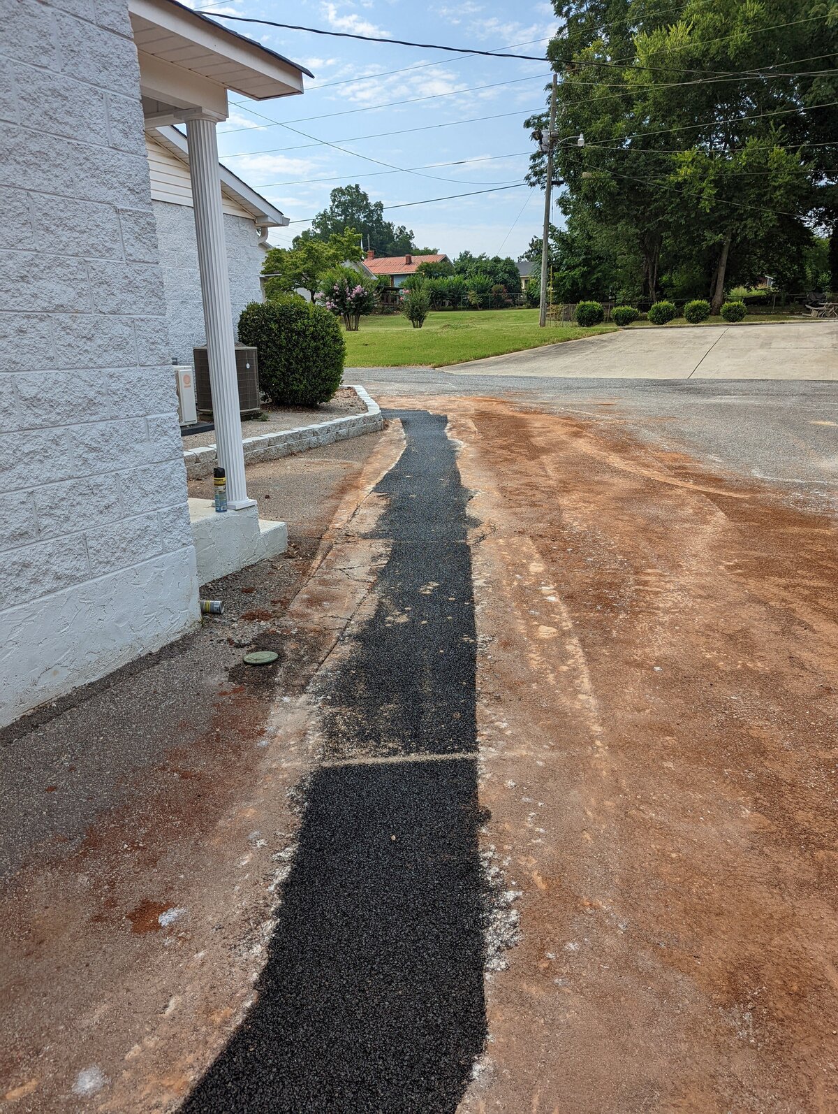 black-asphalt-path-in-neighborhood-on-sunny-day