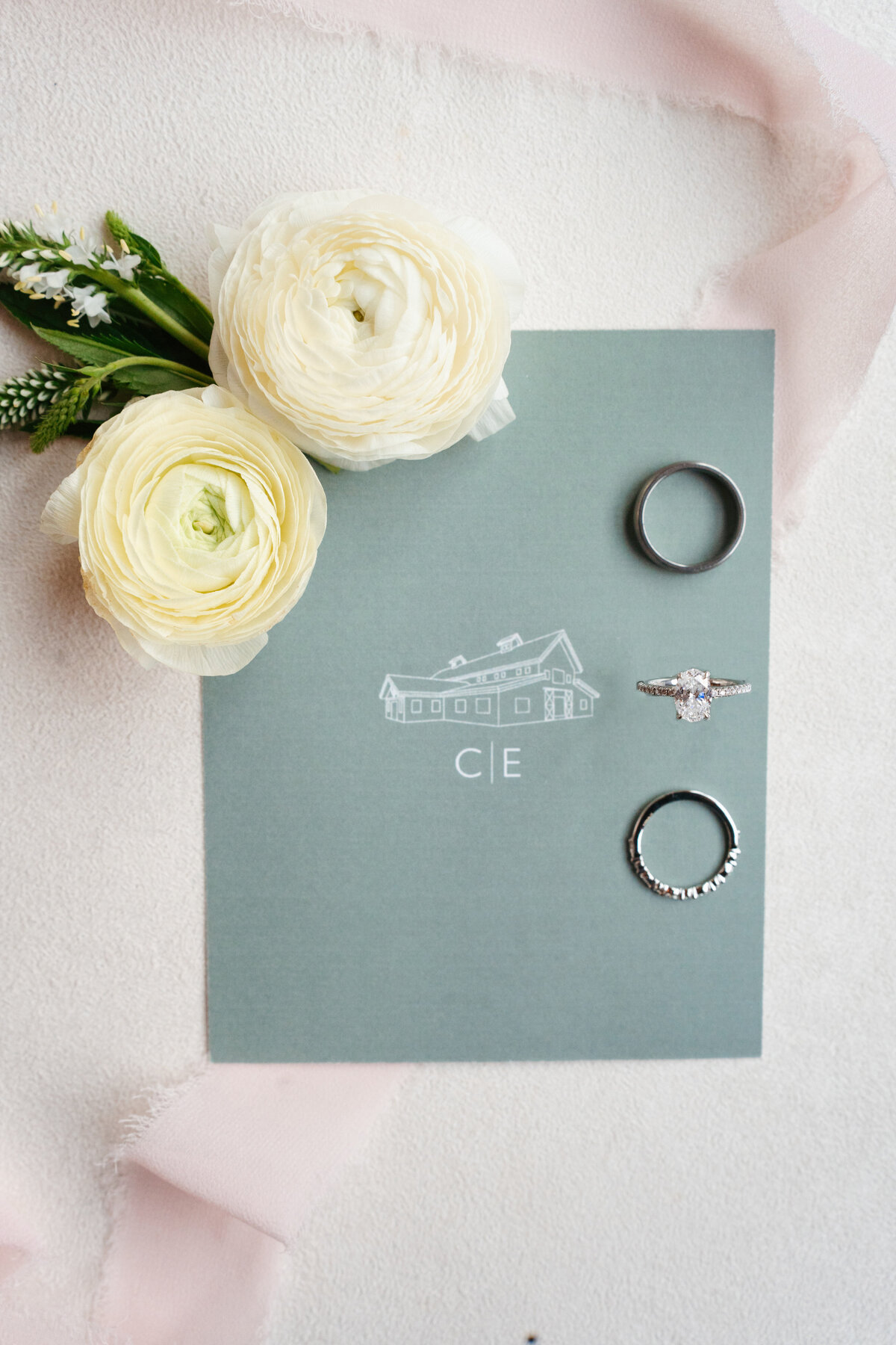 Rustic wedding details with greenery and neutral tones