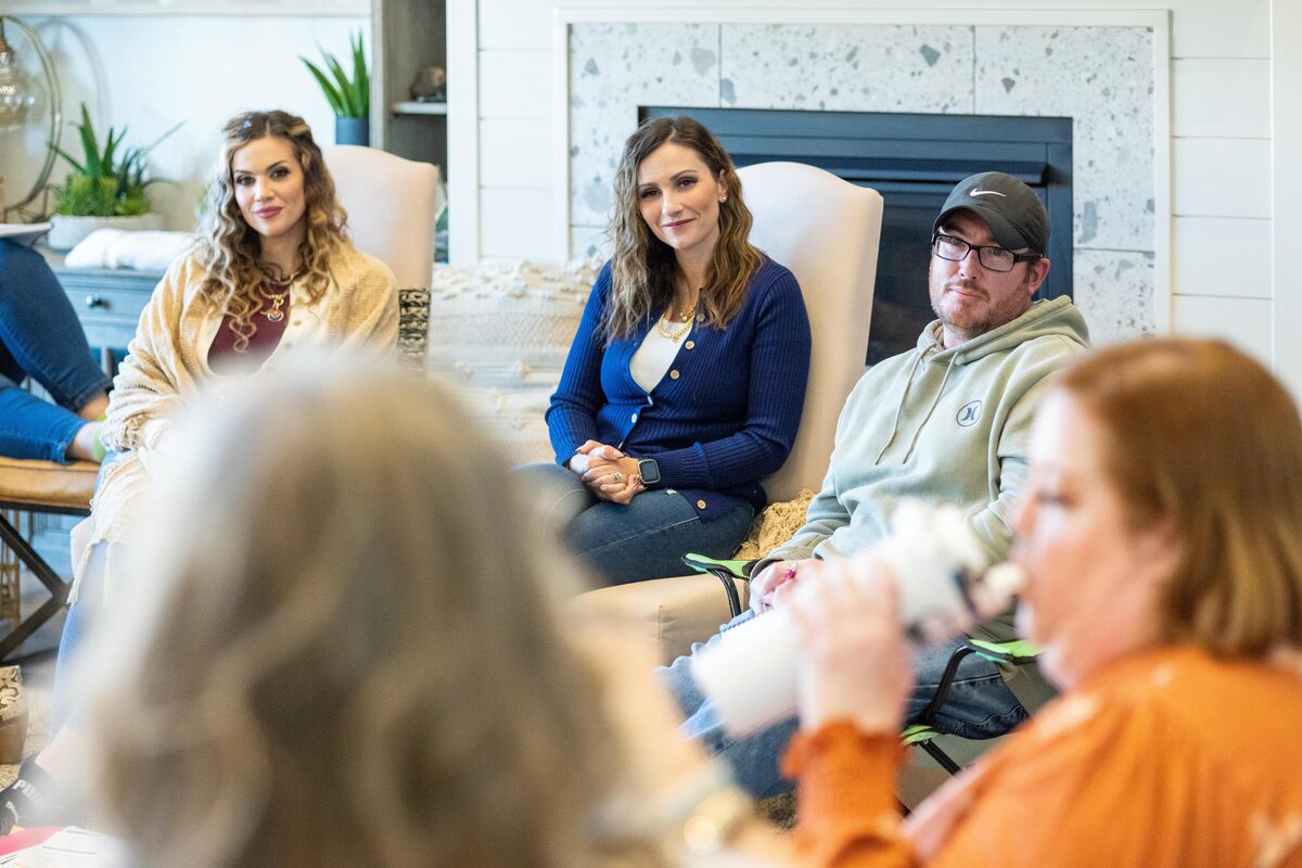 two women listeing to a discussion participant