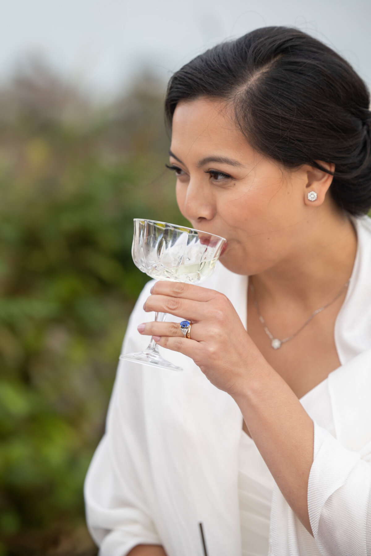 Bride drinking champagne