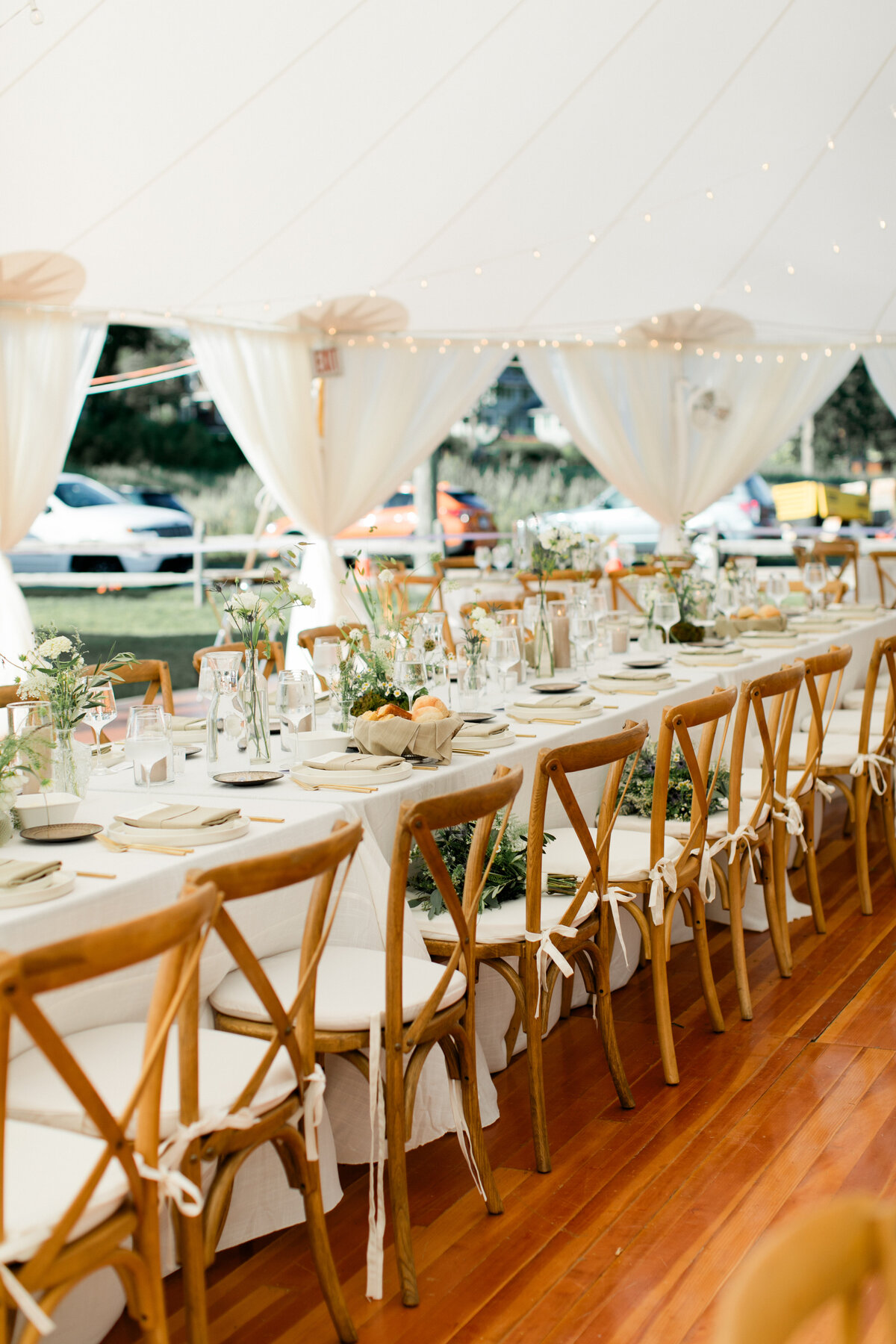 new-england-tent-wedding-greenery-flowers-candles-partial-perimeter-draping