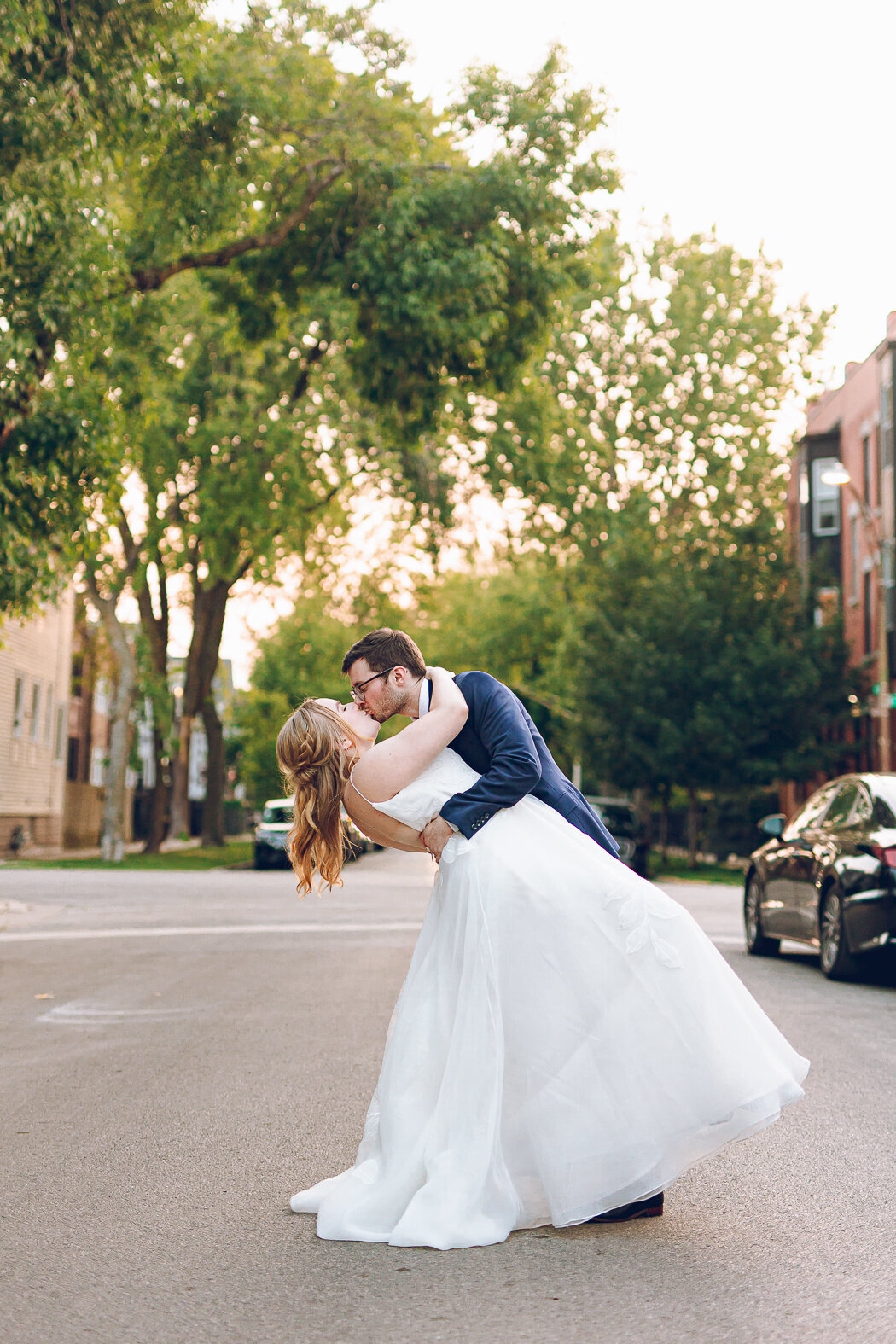 A couple kisses during golden hour at their wedding at The Joinery in Chicago