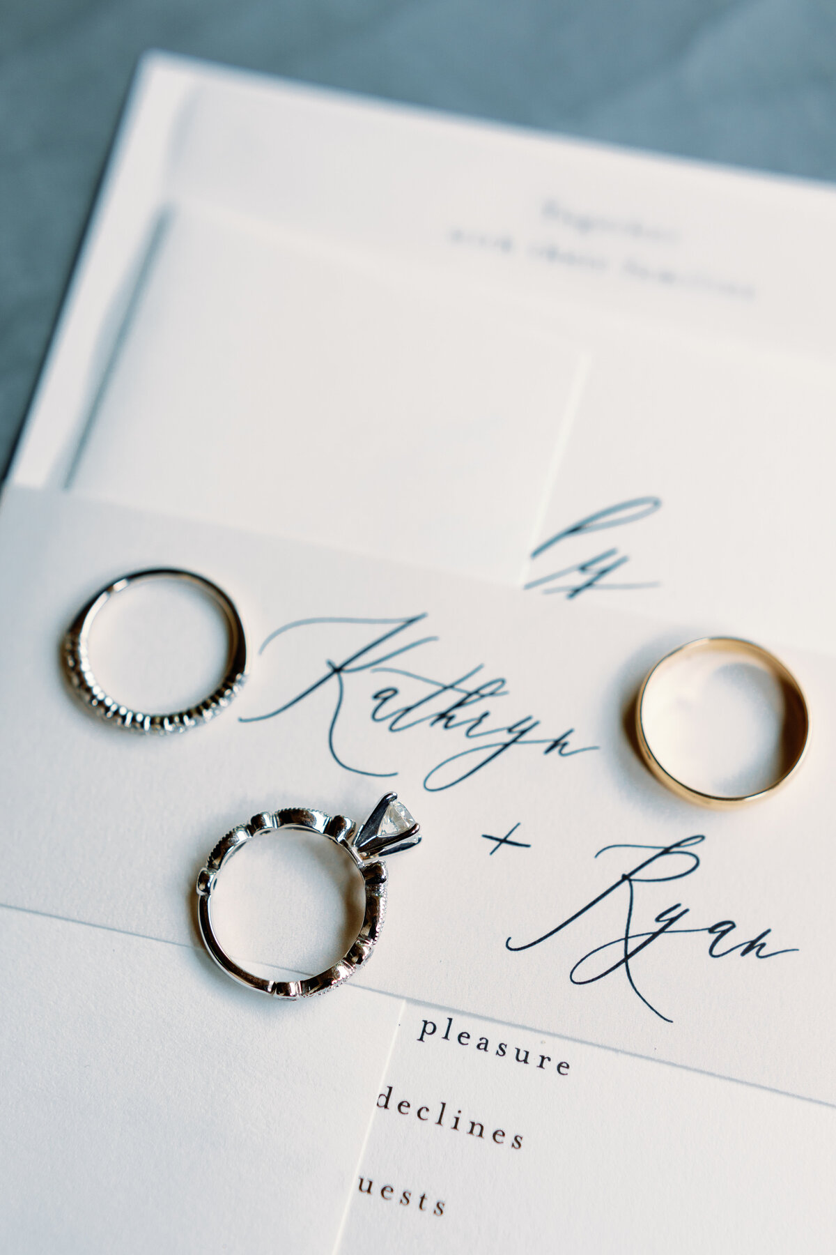 wedding-rings-on-invitation-suite