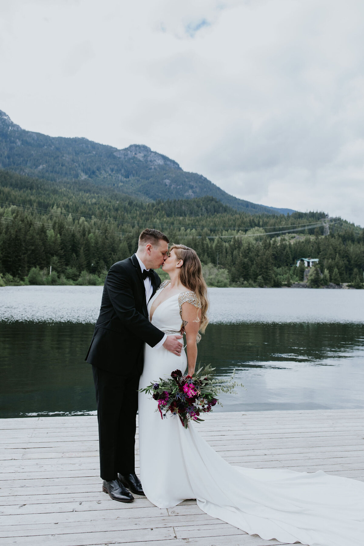 bride and groom kissing at Nita Lake Lodge Whistler wedding - Within the Flowers