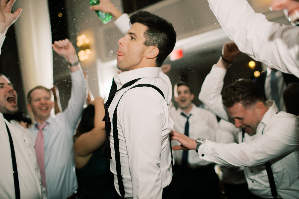 groom dancing with groomsmen during philadelphia wedding reception