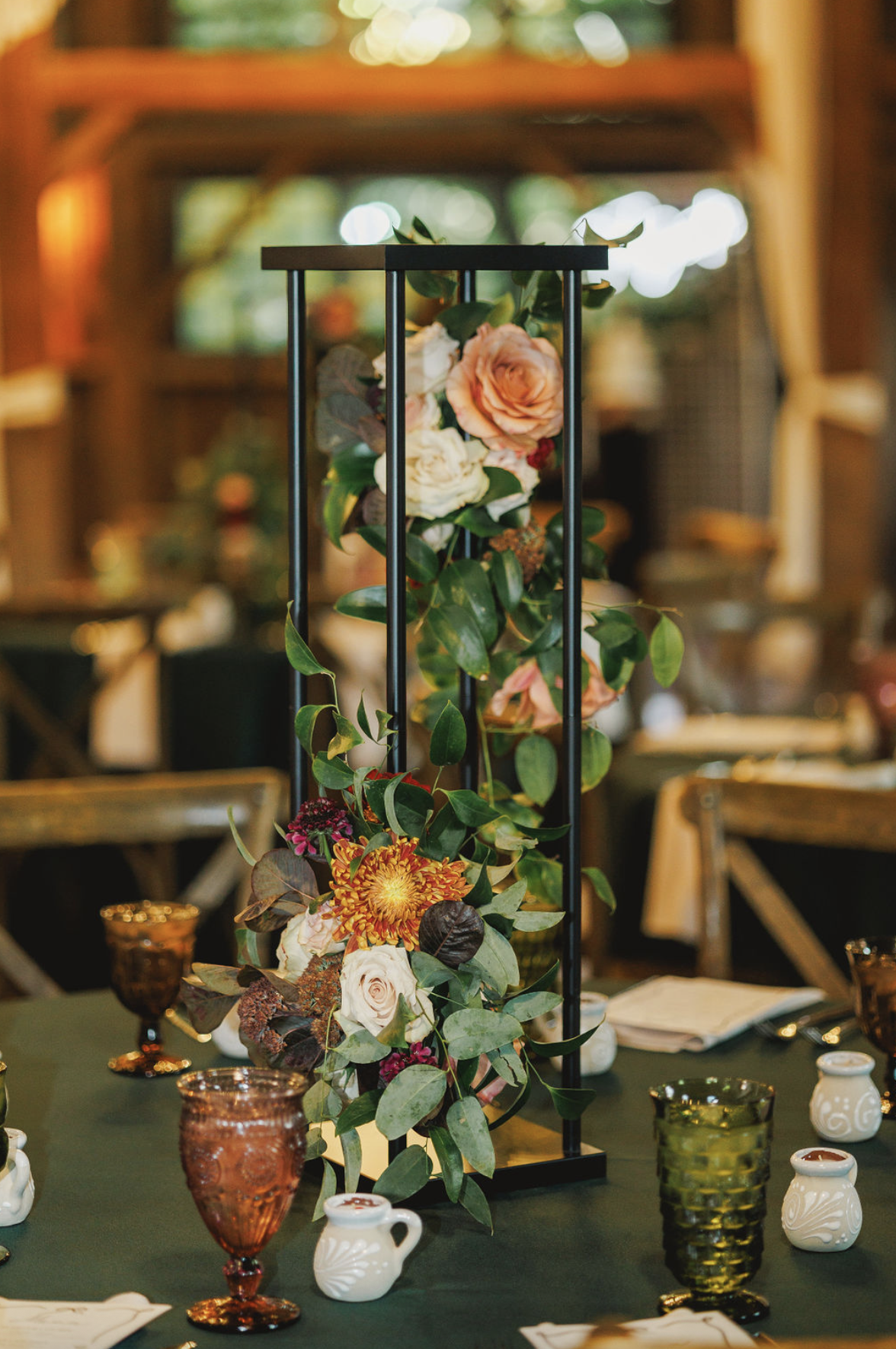black stand with flowers for centerpiece