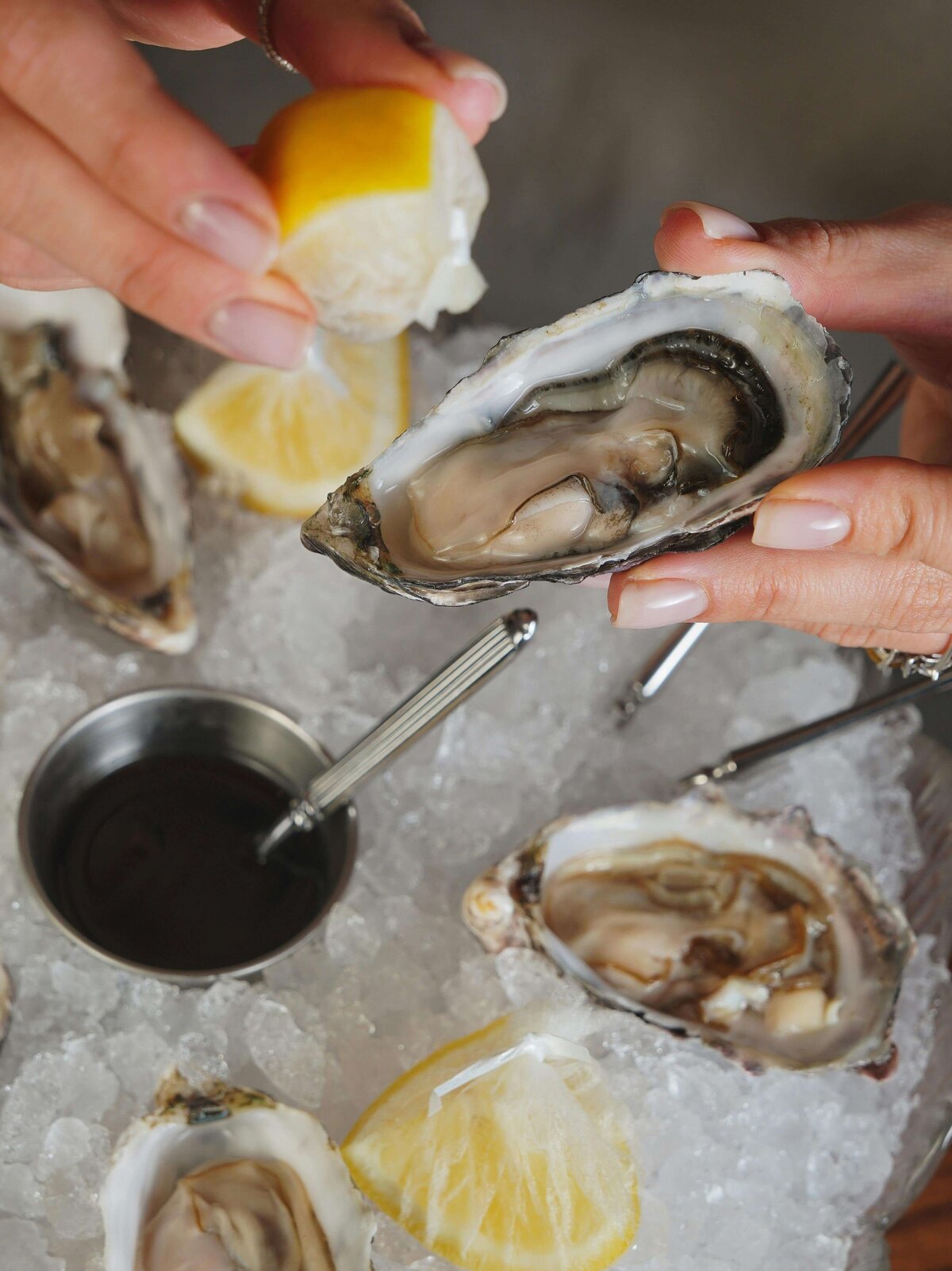 person eating oysters