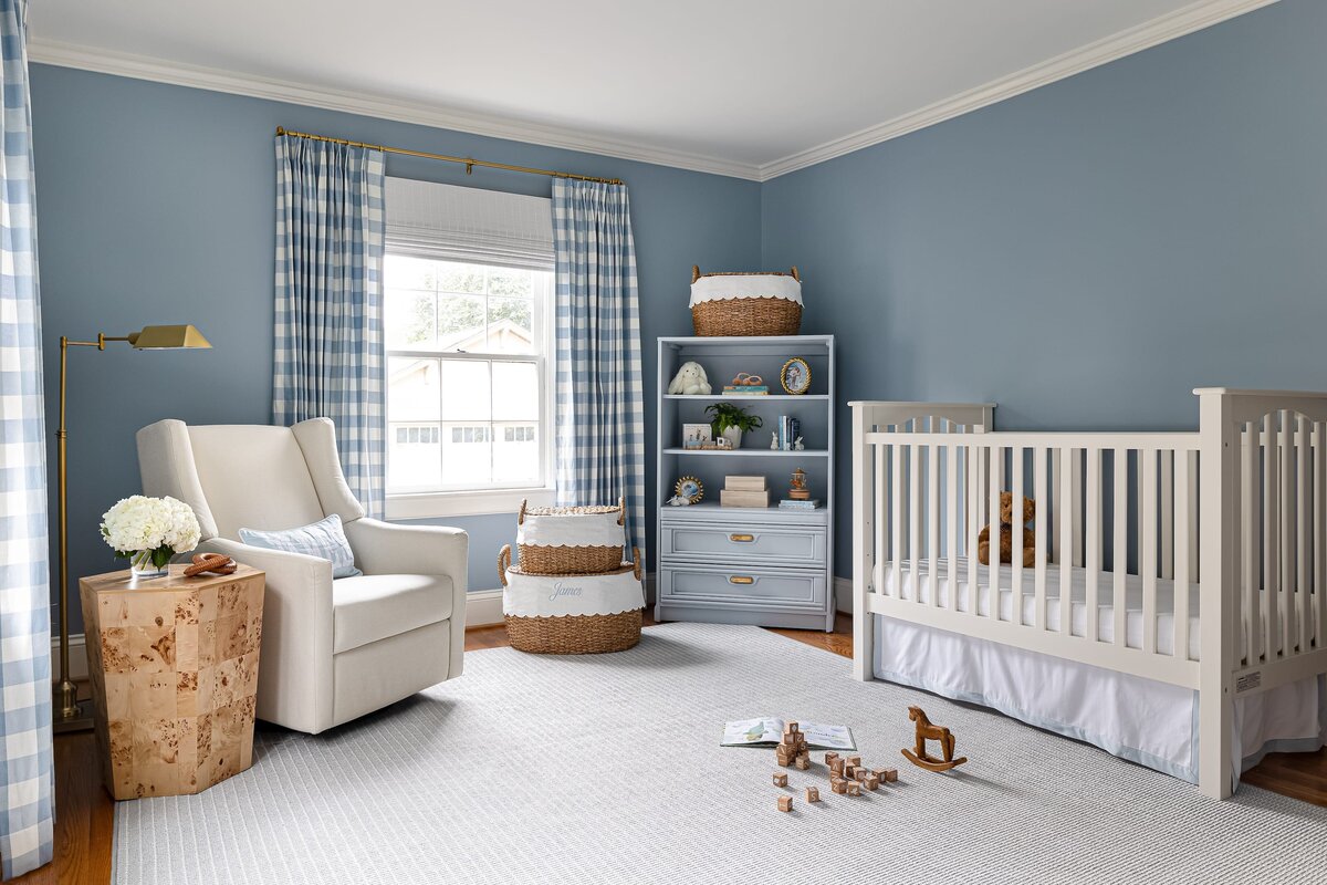 melinda chesson interiors bay street nursery with white crib and wooden blocks on large rug