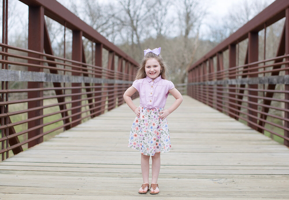 St Augustine family photoshoot, a little girl on a park bridge