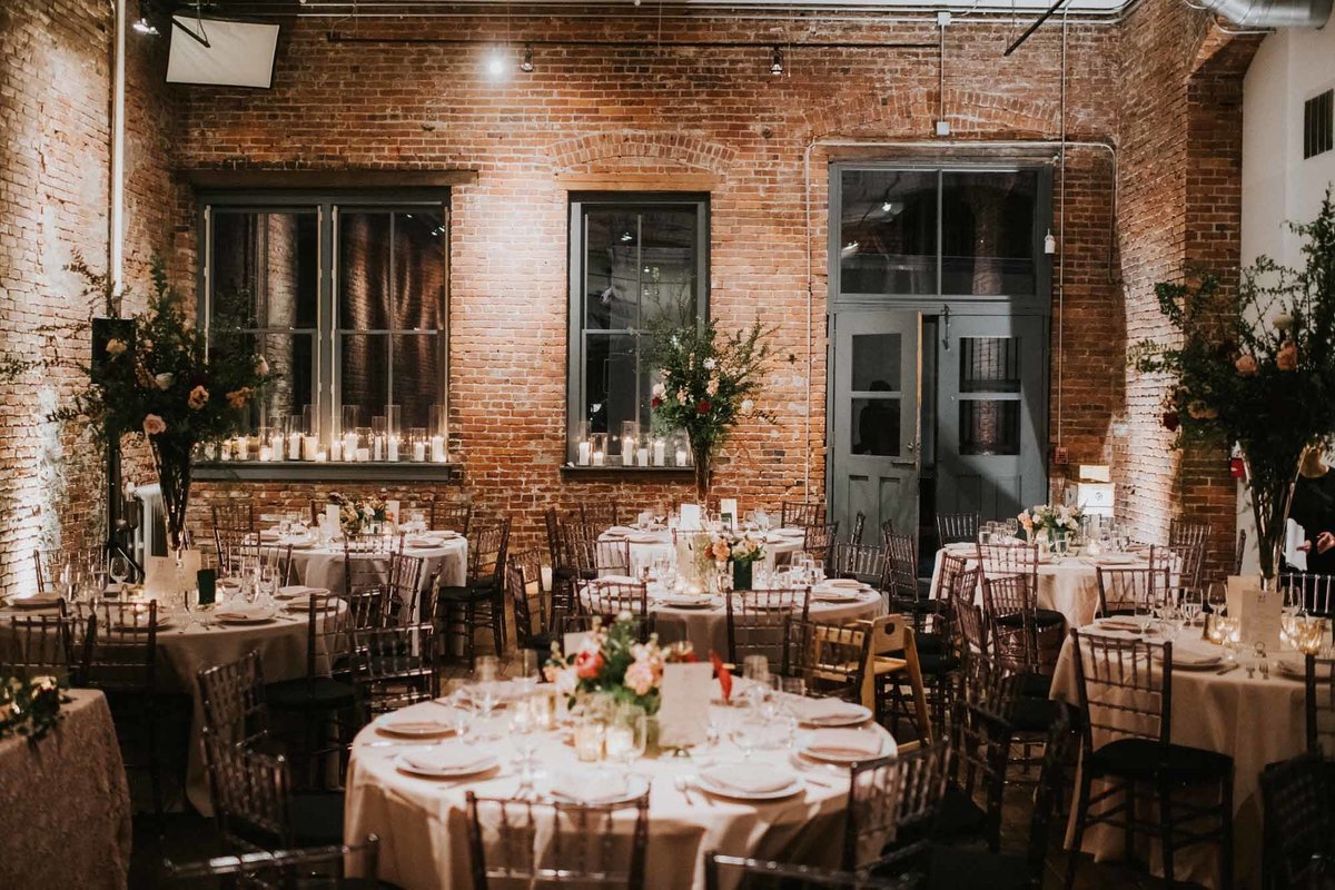 Axis Pioneer Square wedding reception with tall greenery centerpieces