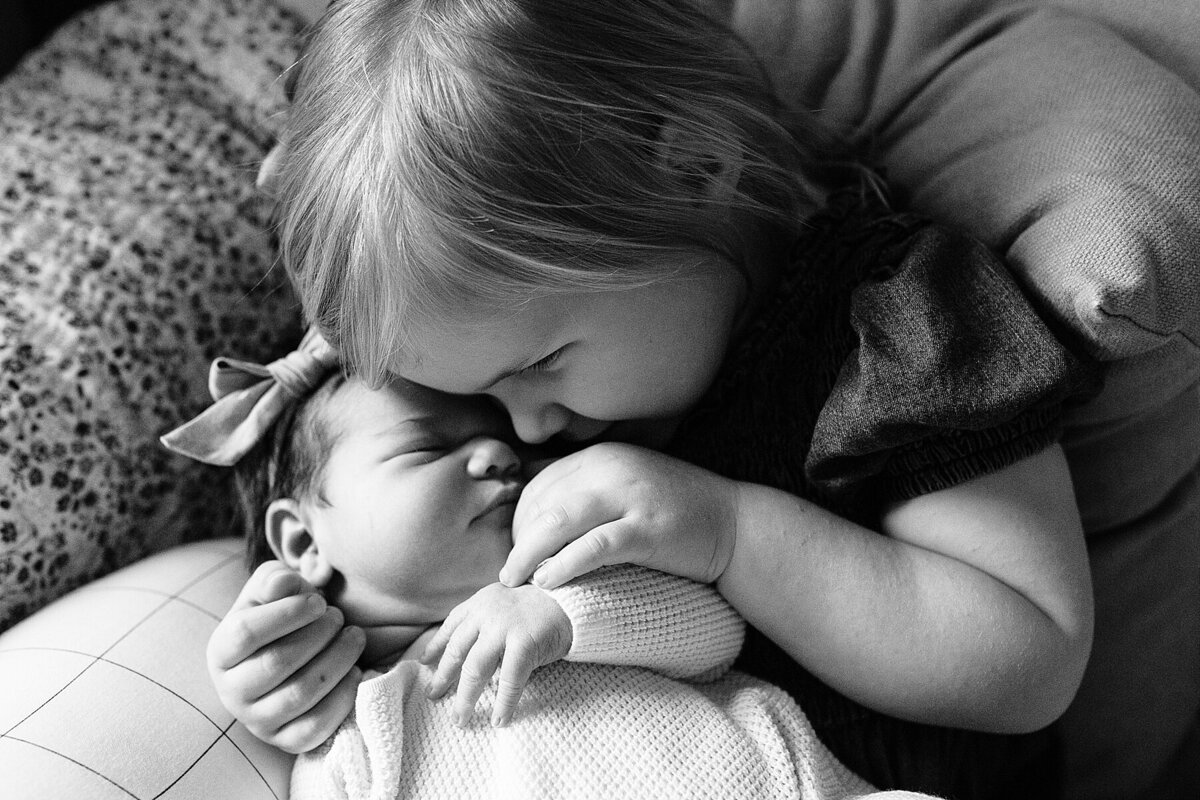sibling love lifestyle in home raleigh newborn