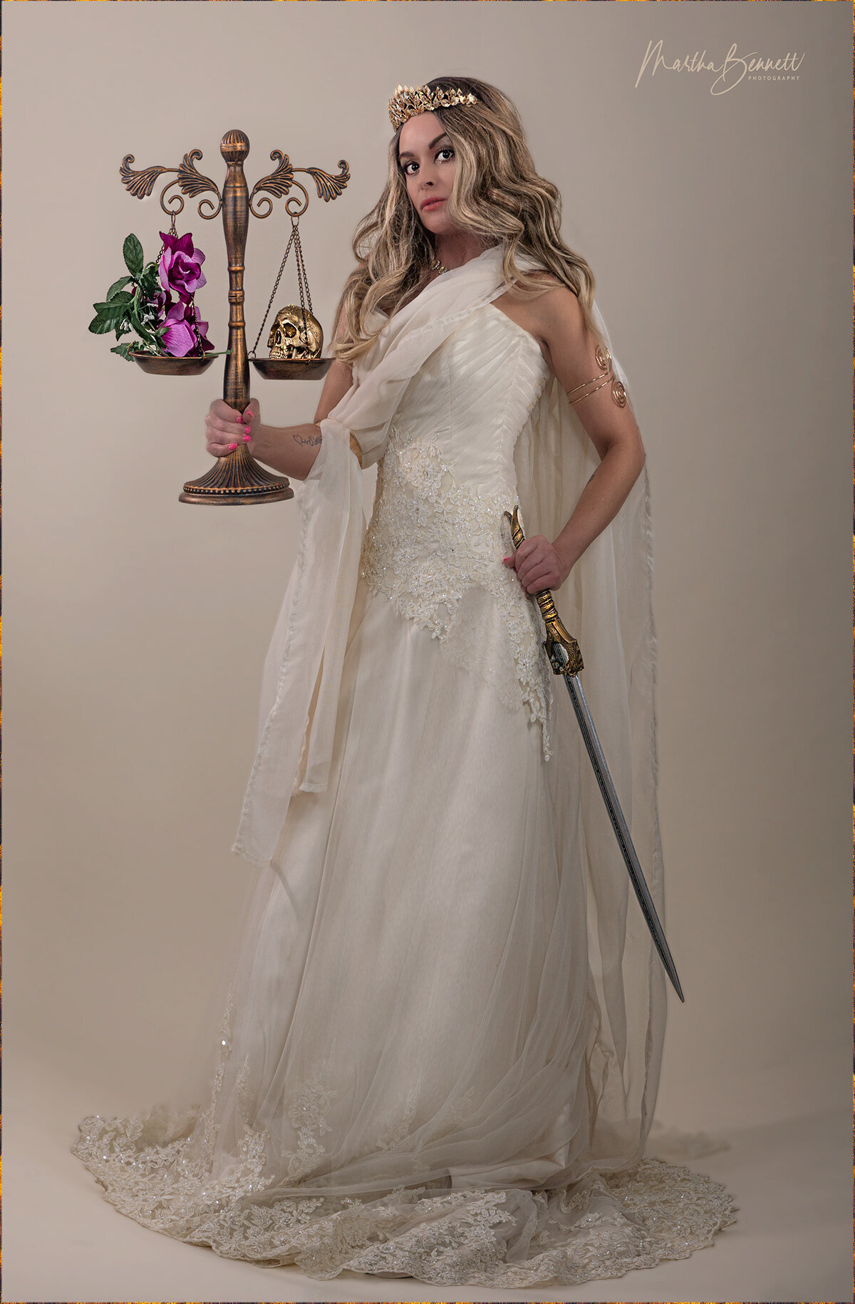 PATRICIA WHITLOCK HOLDING SCALES AND SWORD