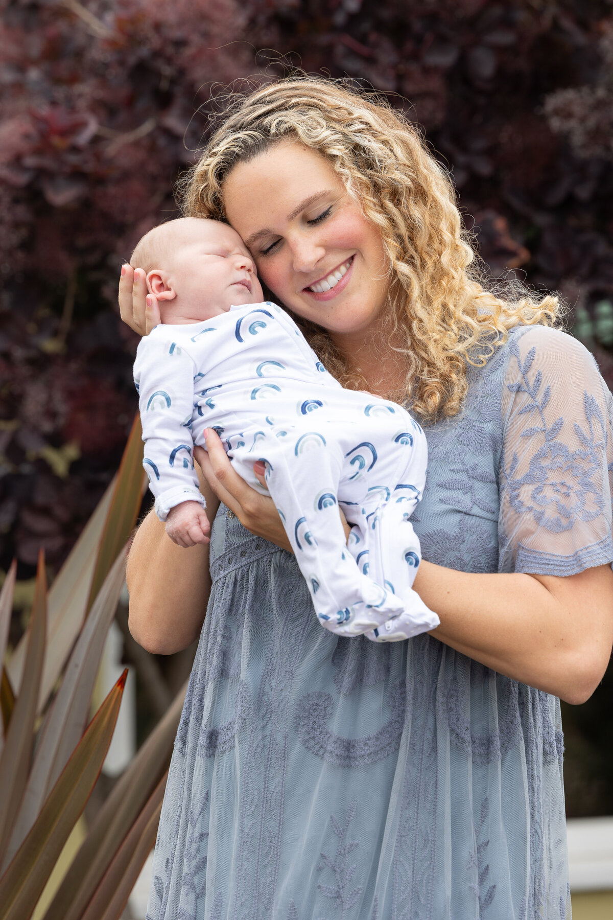 Young mother holding a newborn