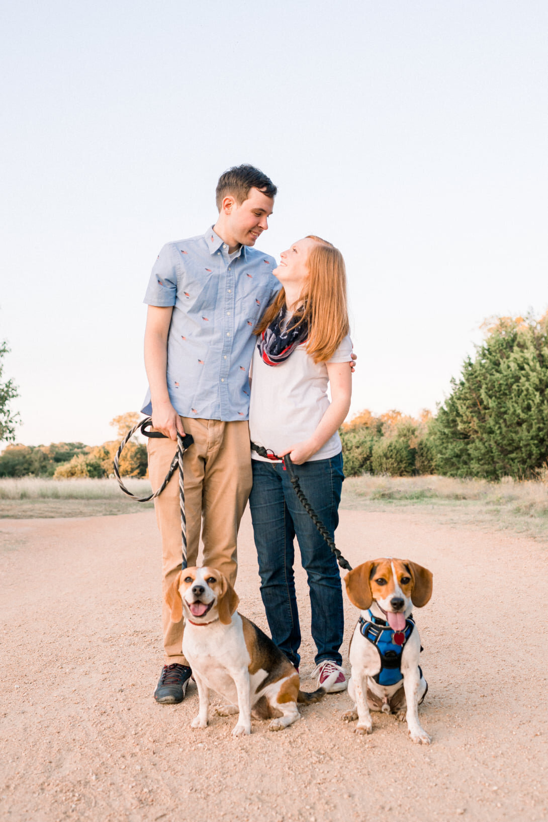 Austin Texas Family photo of family with their puppies at a park.