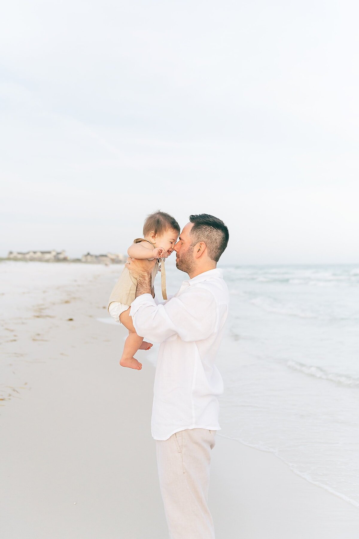 a father and son having fun at the beach