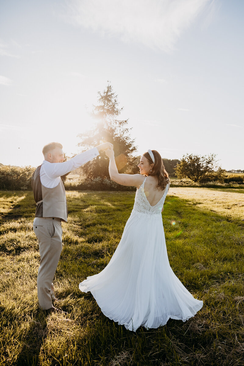 Bride and Groom in a field at Golden hour in Leeds