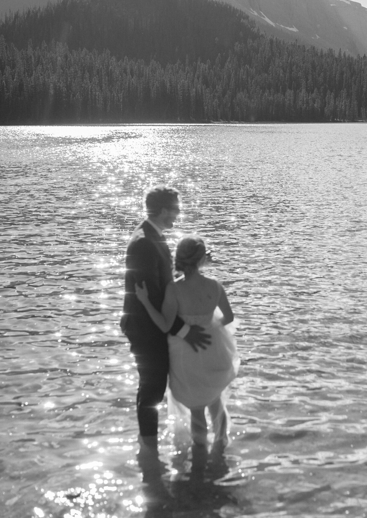 fun adventurous elopement couple in mountain lake