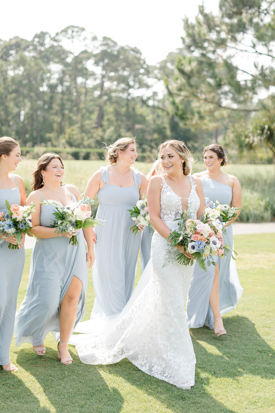 Bride and bridesmaids walking at Long Cove Club; Hilton Head Island, South Carolina
