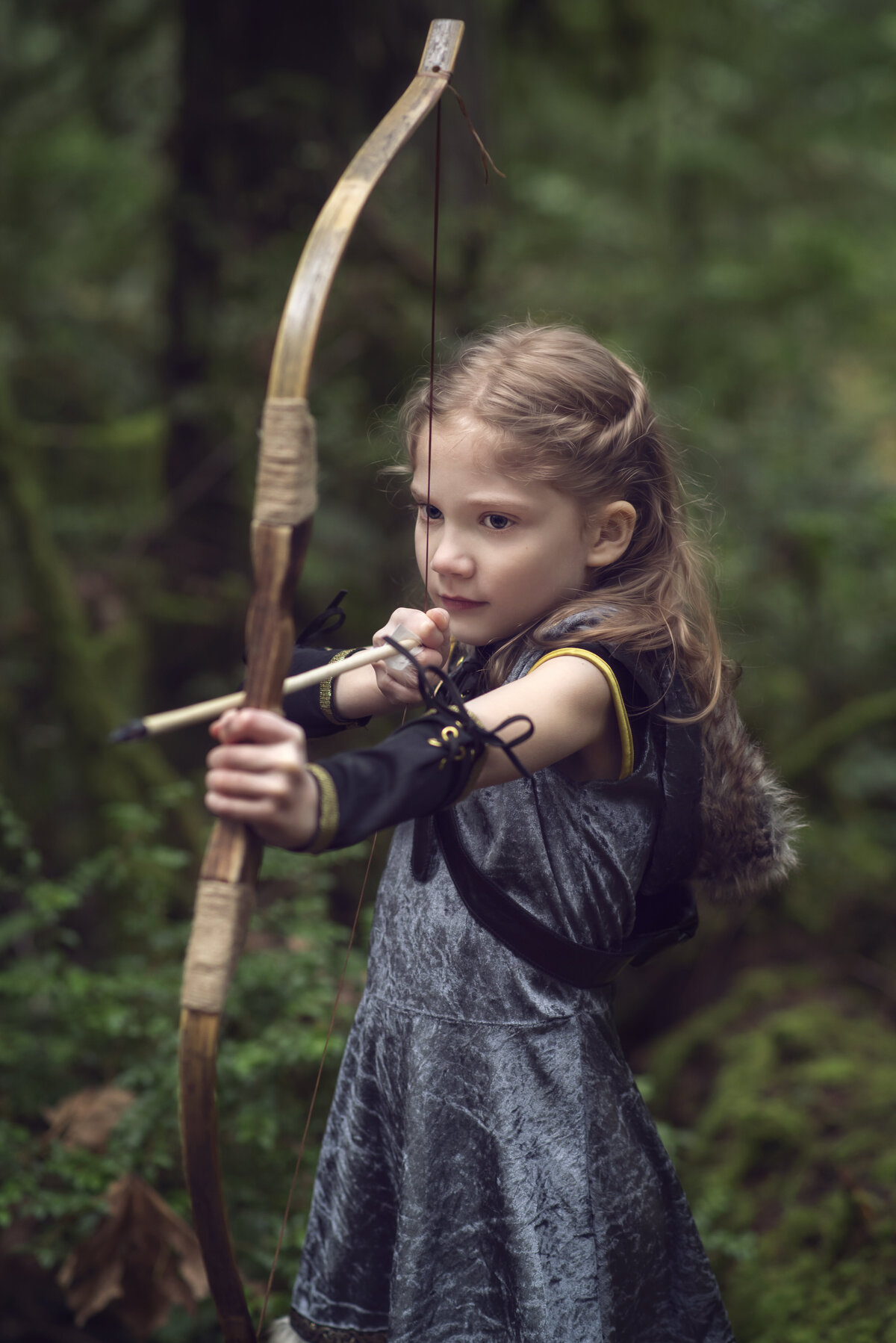 Archer girl shooting arrow