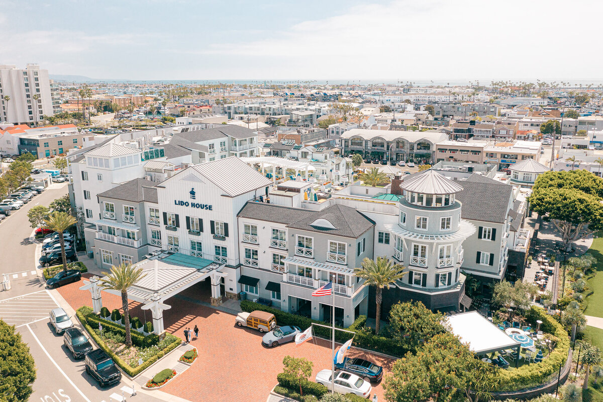 Drone aerial view of Lido House in Newport Beach, showcasing the luxury coastal hotel and surrounding marina