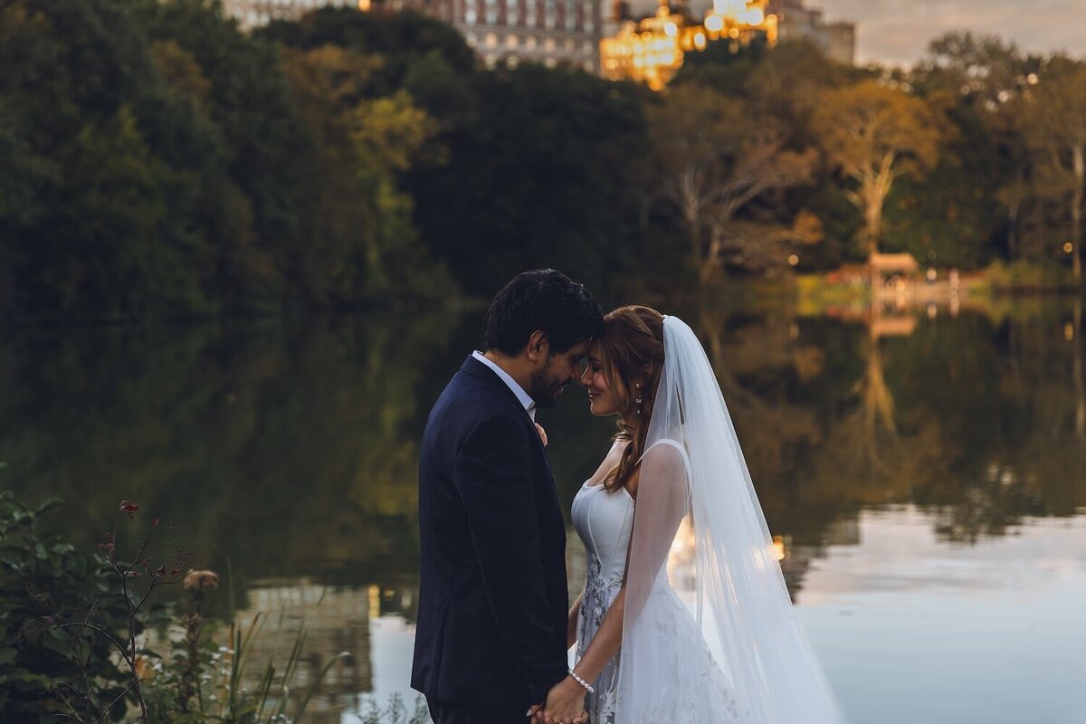Bride touching groom’s face during heartfelt vow exchange