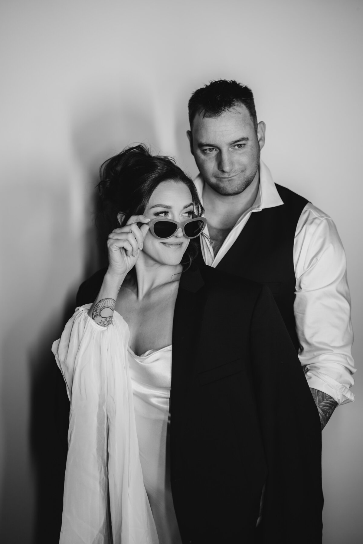 bride and groom posing in photobooth