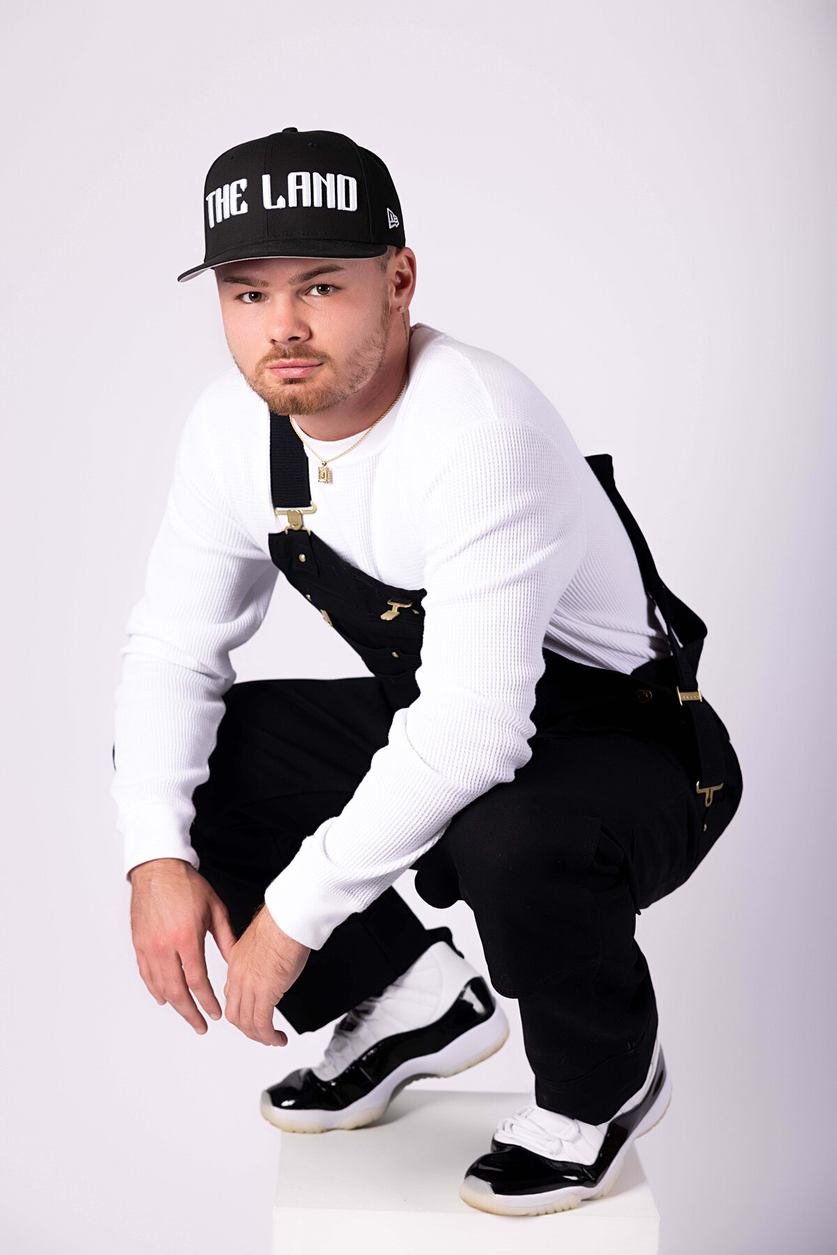 Professional boxer sitting on a box in birthday session with Reva Davis photography