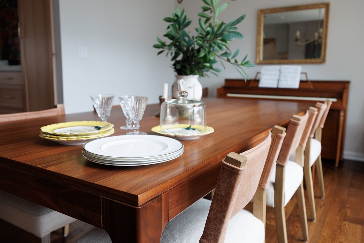 the keeping room interiors oakview dining room table with plates and glasses