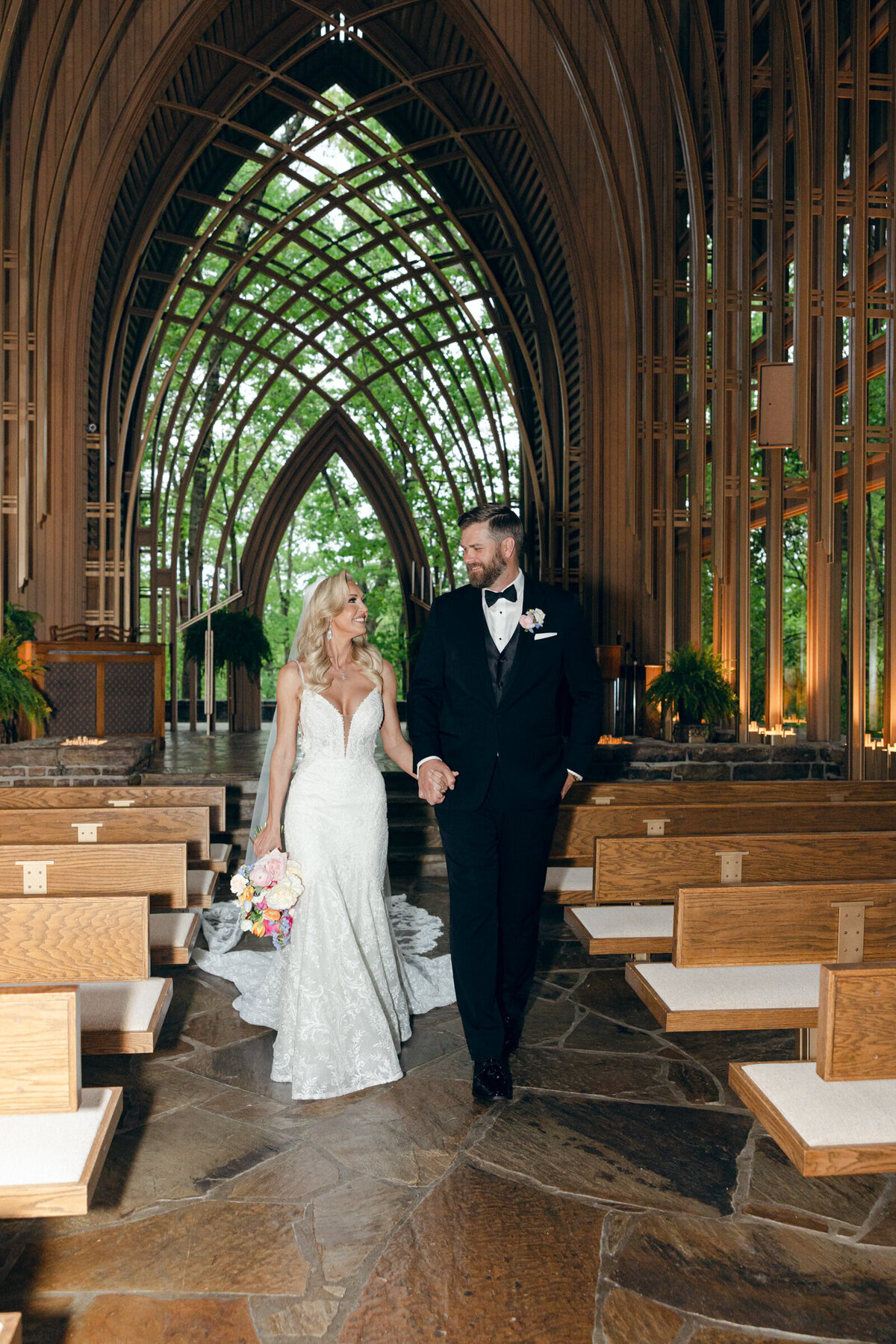 A wedding photo of the bride and groom on the alter at Anthony's Chapel in Hot Springs Arkansas