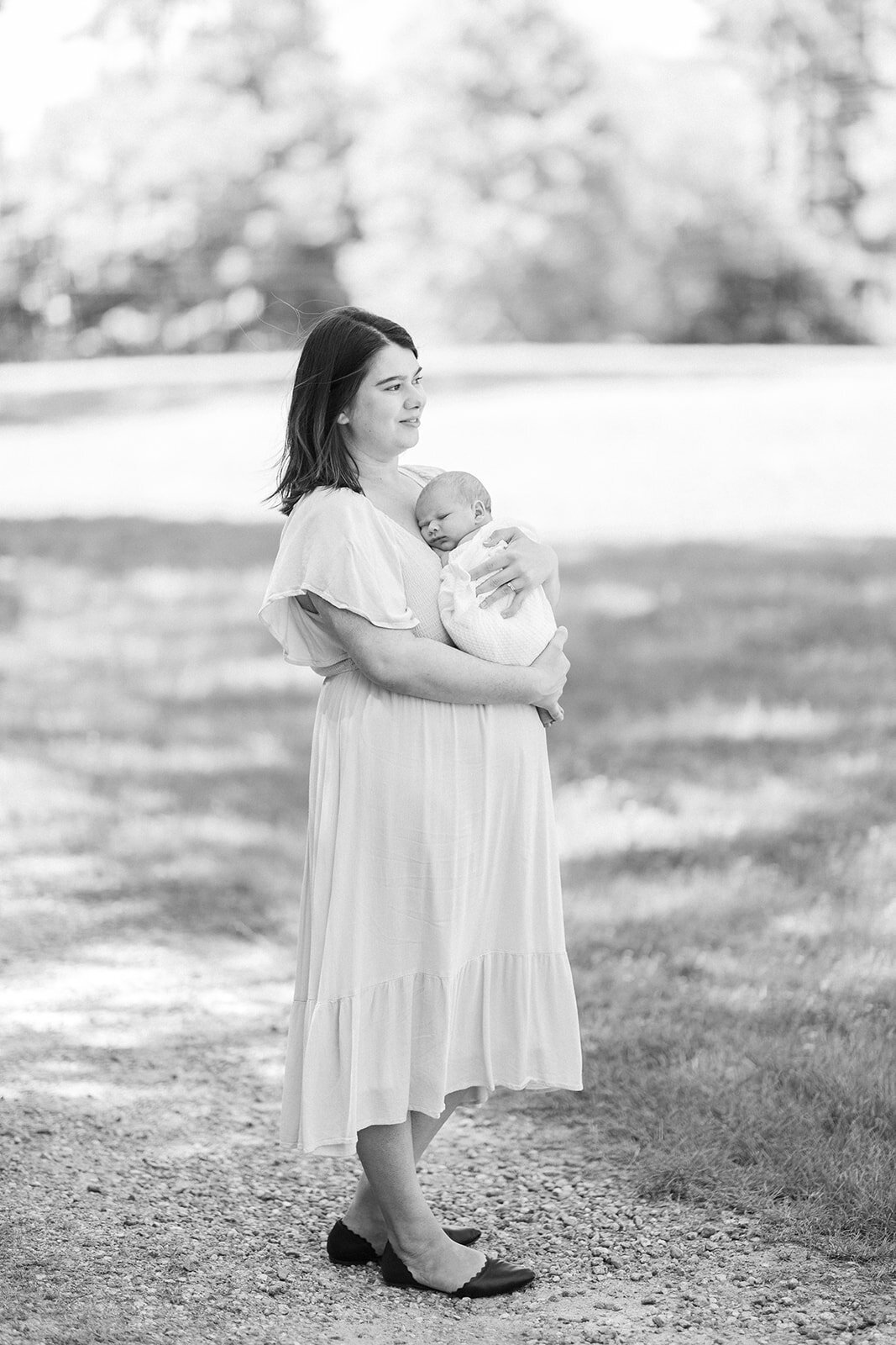 Patton family snuggling newborn during in-home portrait session