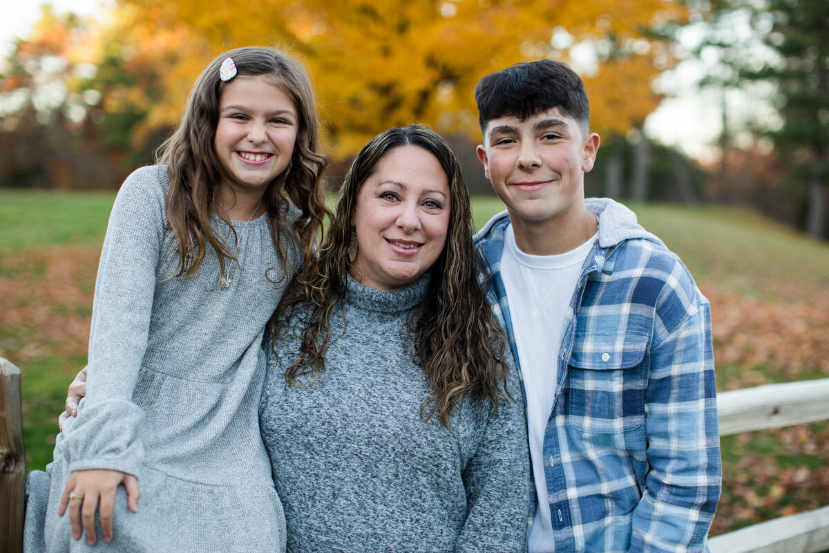 Mother with her son and daughter two children smiling