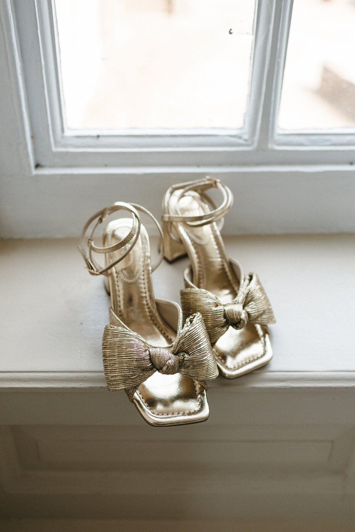Gold bridal shoes with bows