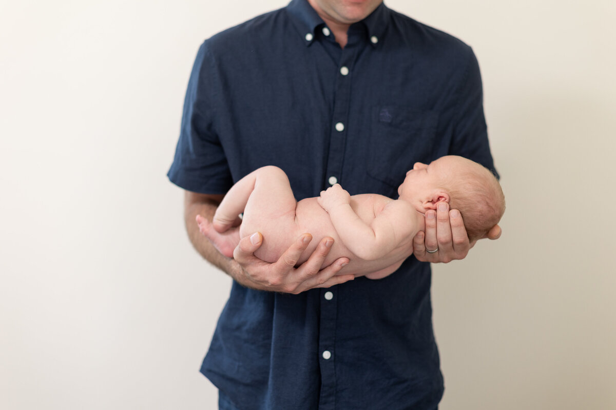 father holding a baby boy