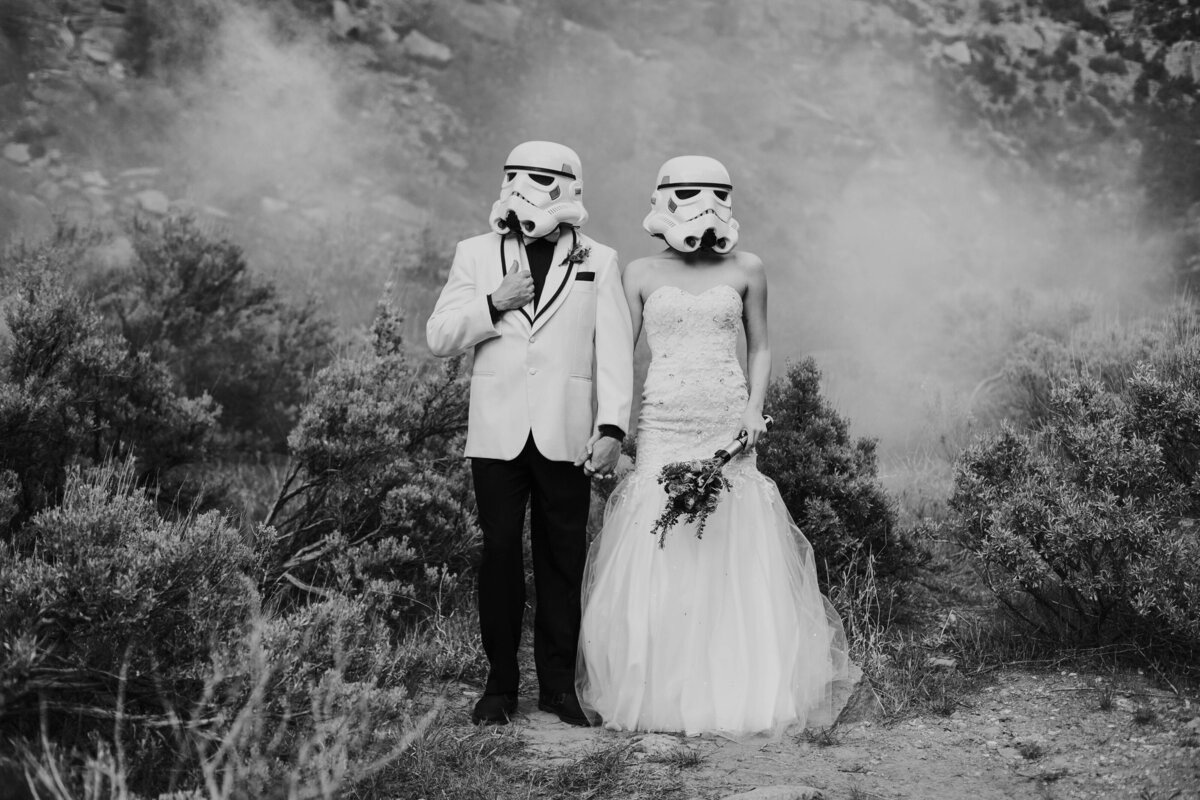 bridal couple wearing storm trooper helmets during outdoor bridals