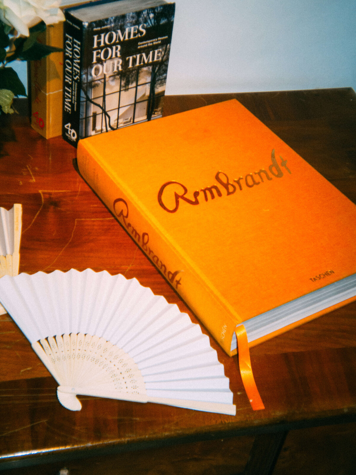 Close-up of orange "Rembrandt" book and design decor at Soho House

