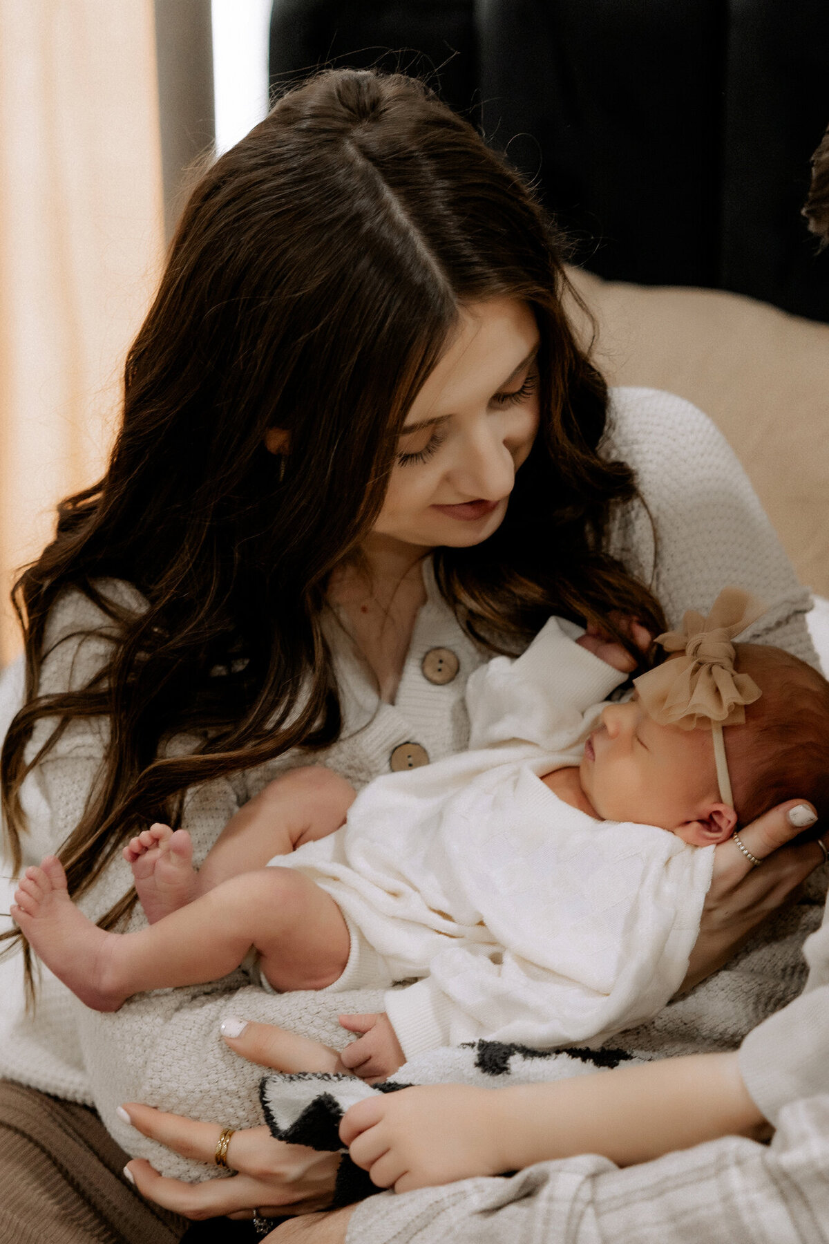newborn photo of mama cradling baby girl in arms photo taken by lubbock newborn photographer mary wiebe photography