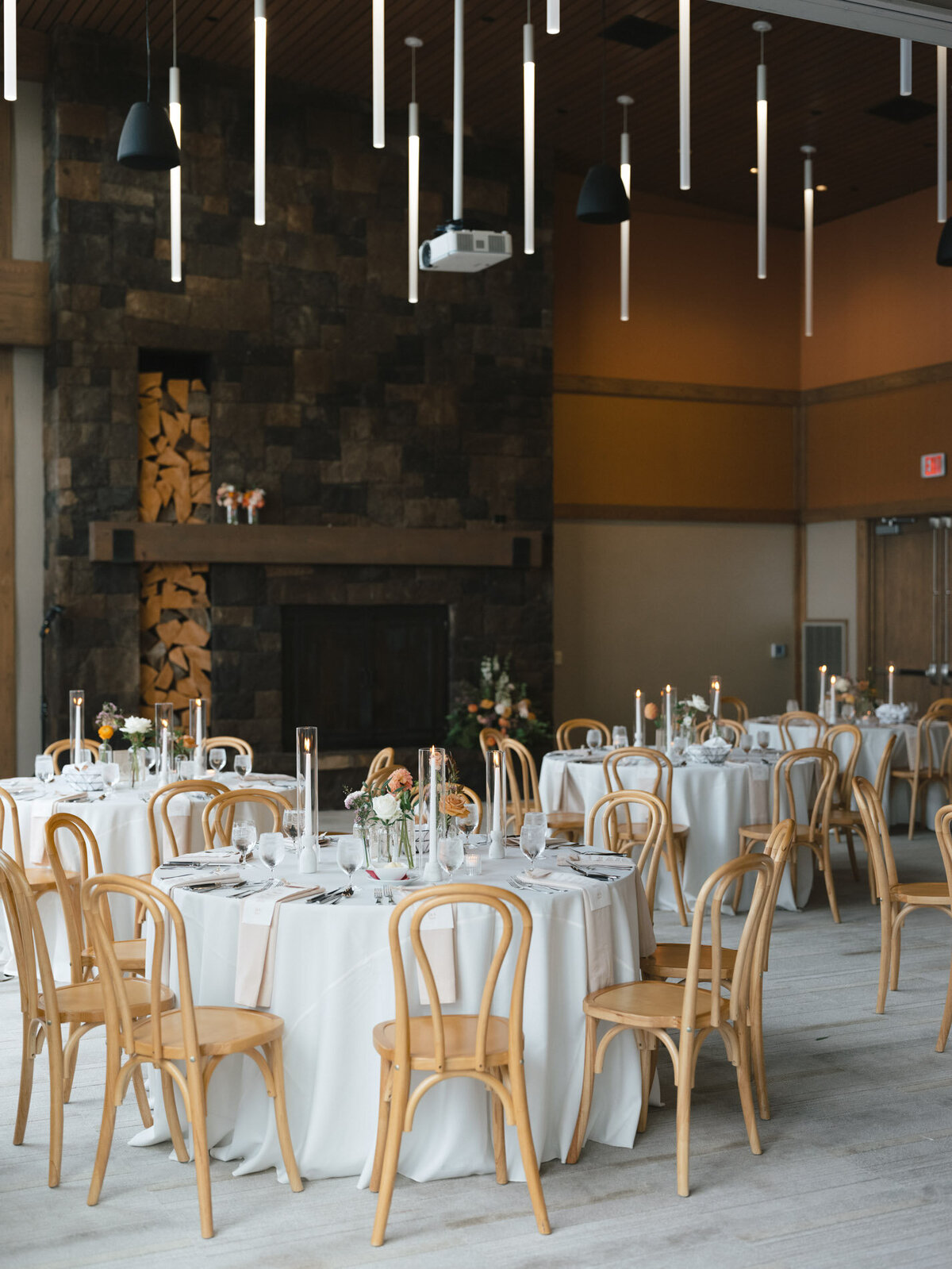 oregon wedding reception tables with wood chairs featuring custom calligraphy details by life in letters representing full service design and calligraphy by Life in Letters.