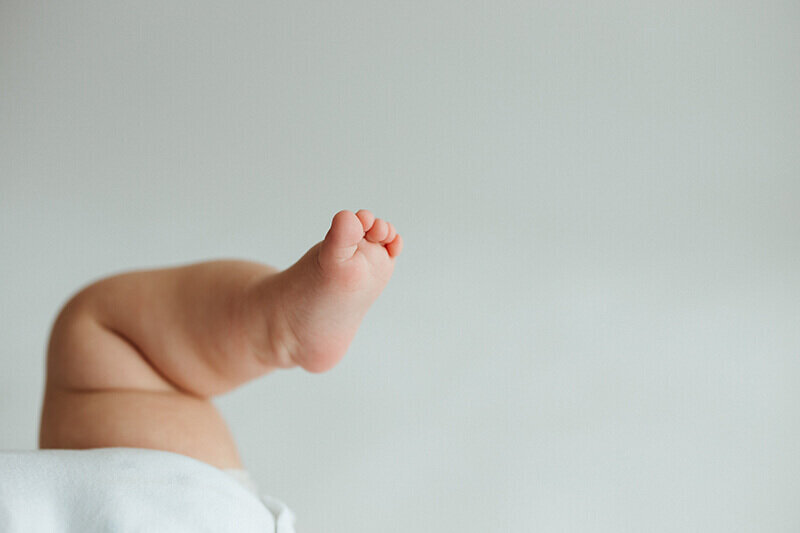 close up of six month old baby toes